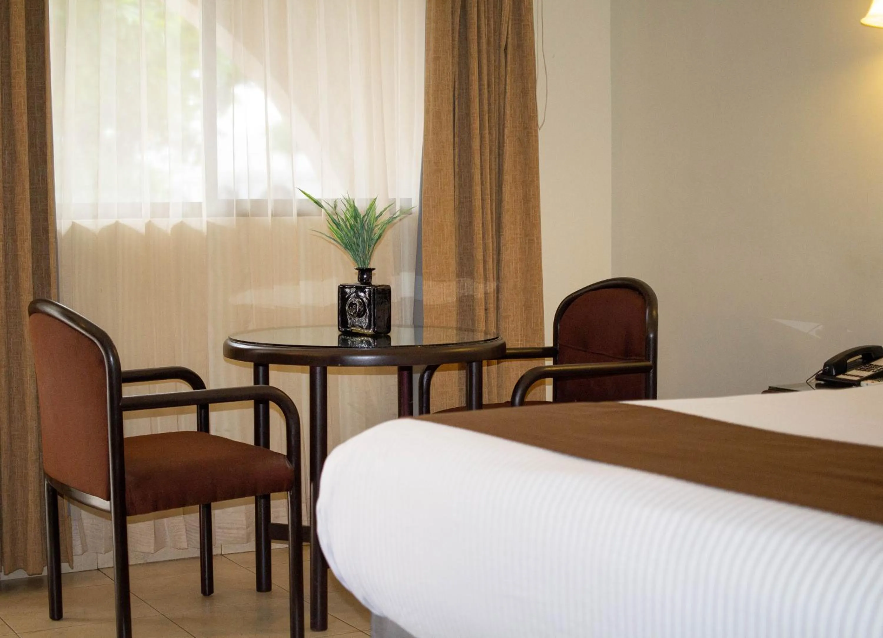 Living room, Bed in Hotel Del Rio