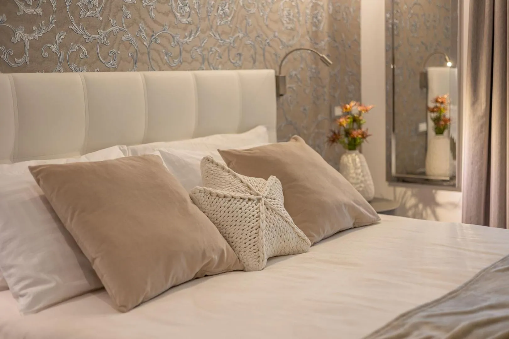 Bed in Romagna Suite Hotel