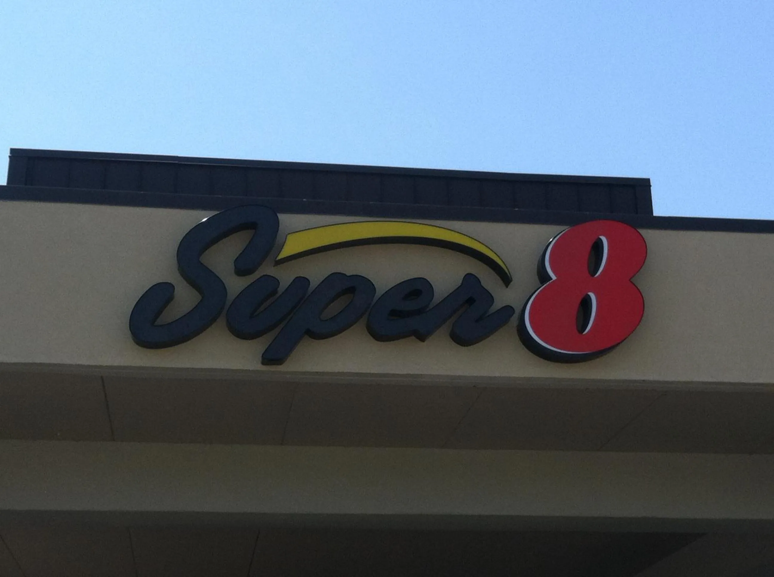 Property logo or sign in Super 8 by Wyndham Calhoun