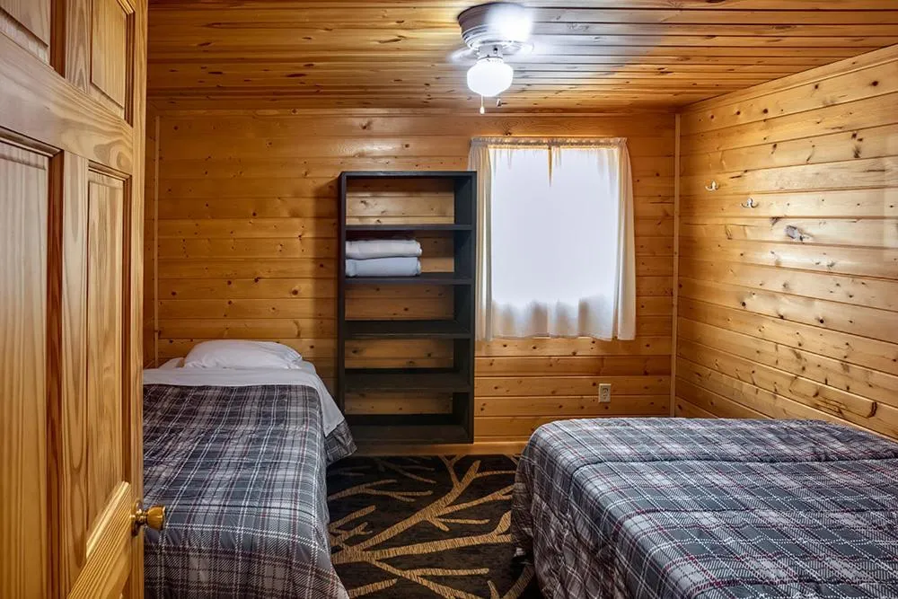 Bed in Big River Escape Riverside Cabins