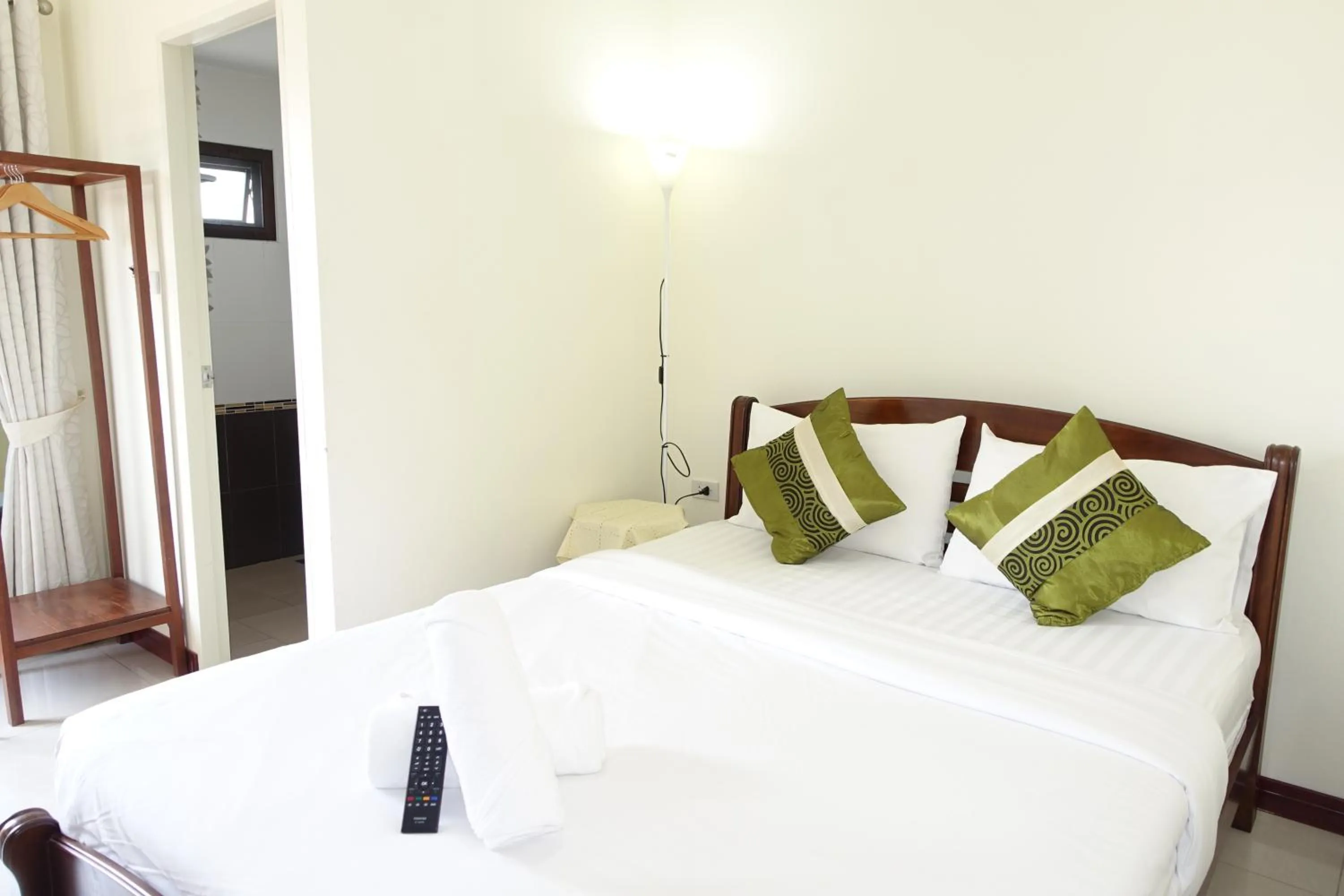 Bed in Baan Taweesuk Guest House