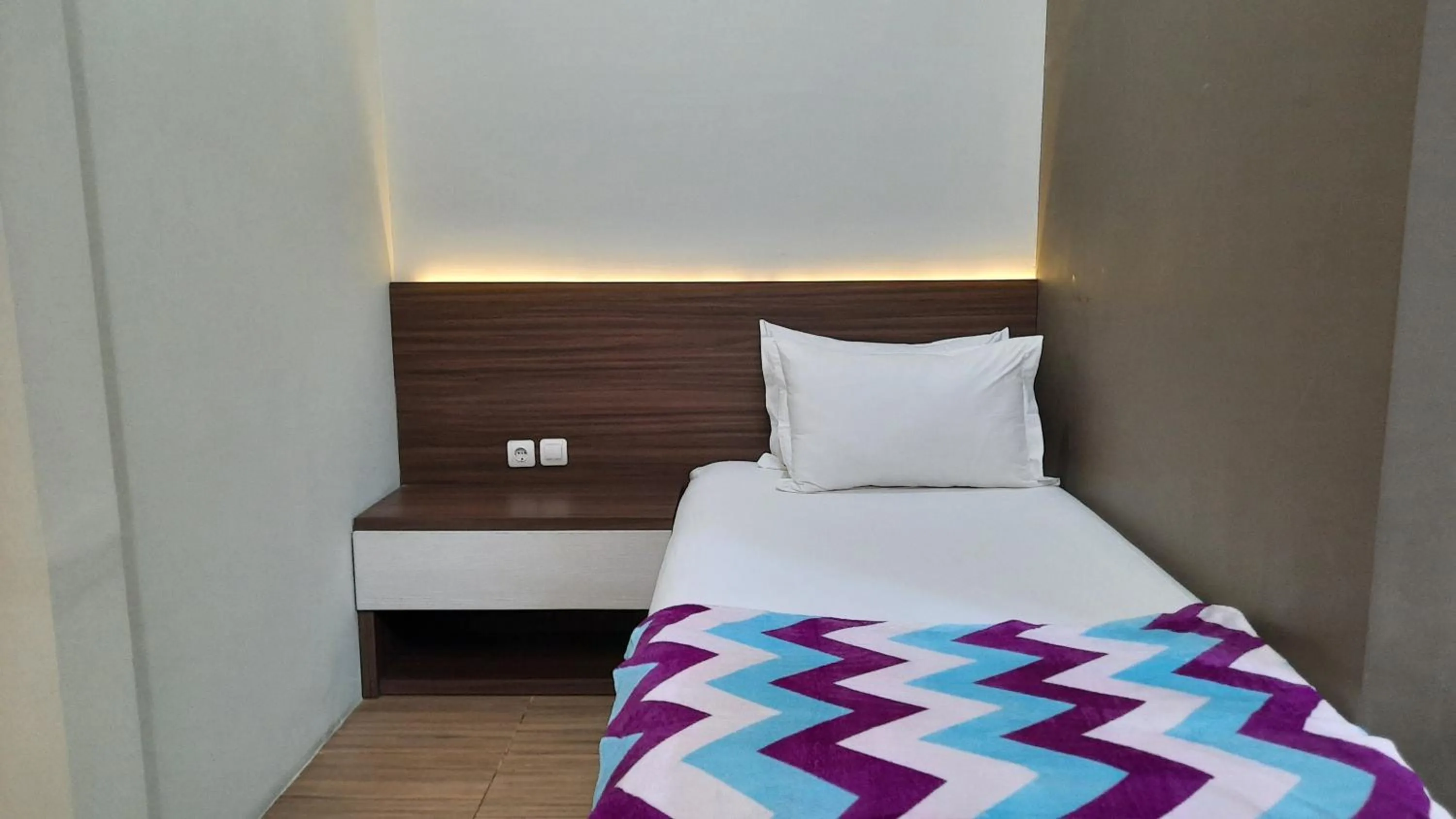 Bed in The Peak Guest House