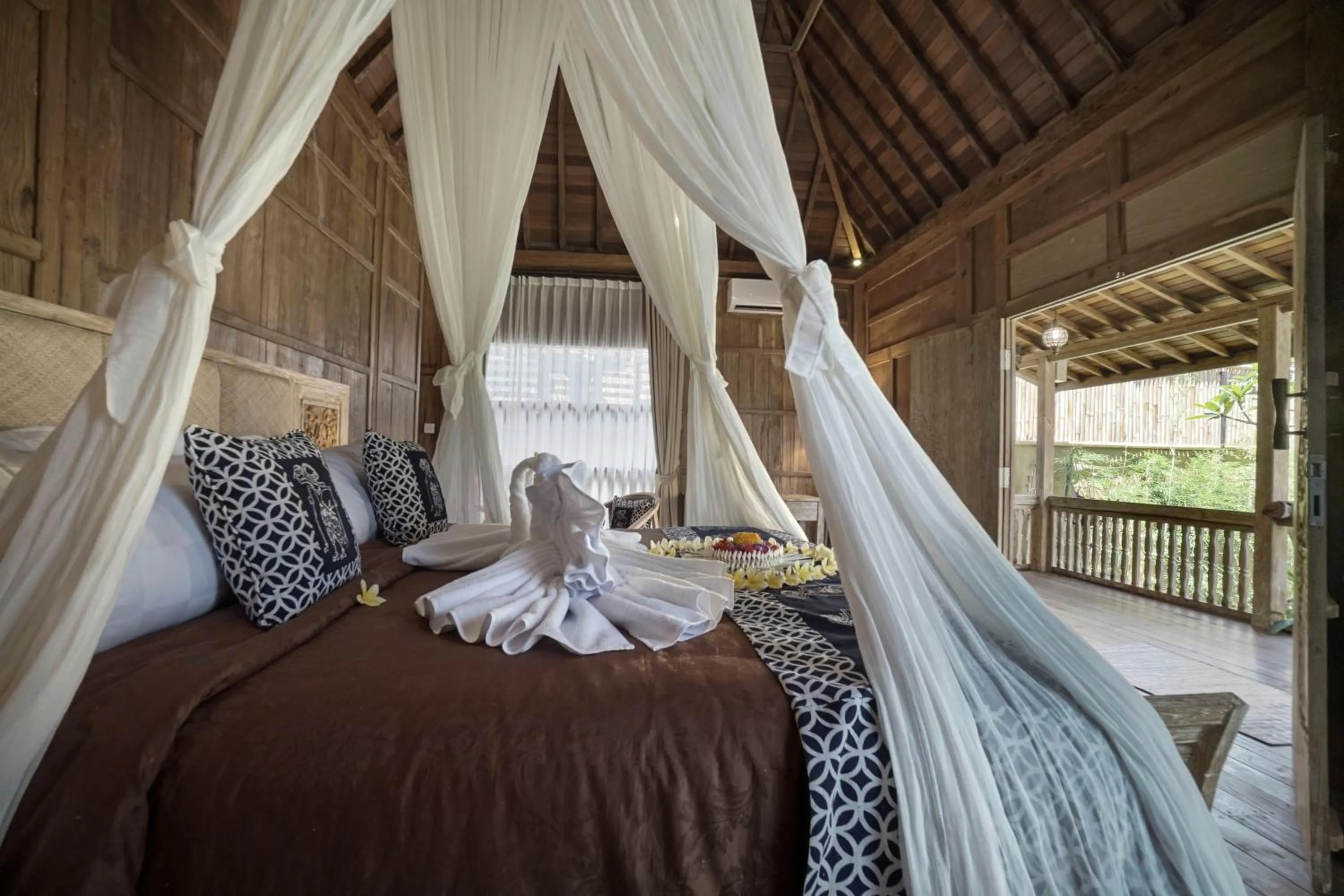 Bed in Kirani Joglo Villa Bali by Mahaputra