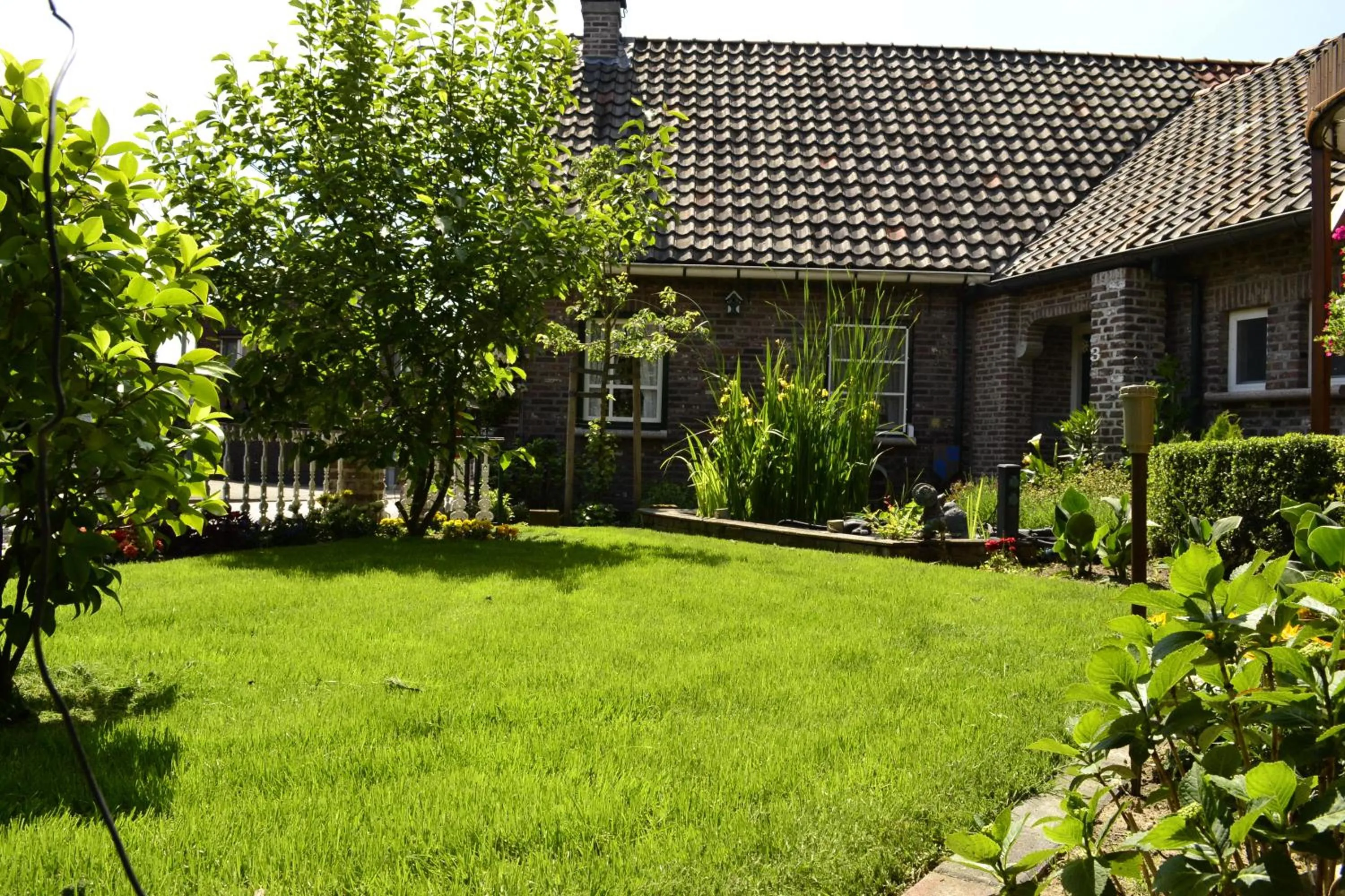 Garden view, Property Building in Pension Neske