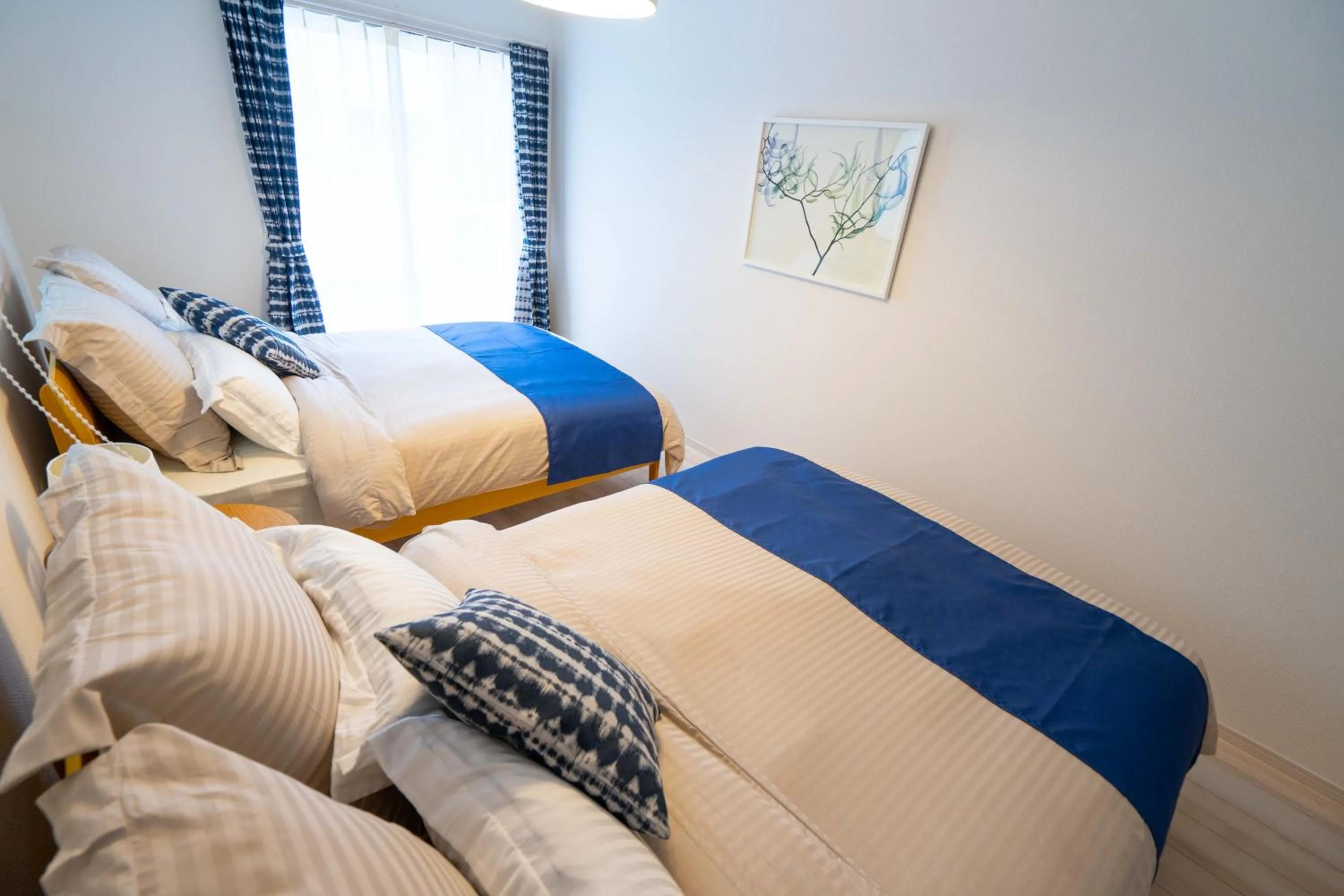 Photo of the whole room, Bed in OKINAWA BEACH HOUSE Golden Drop S