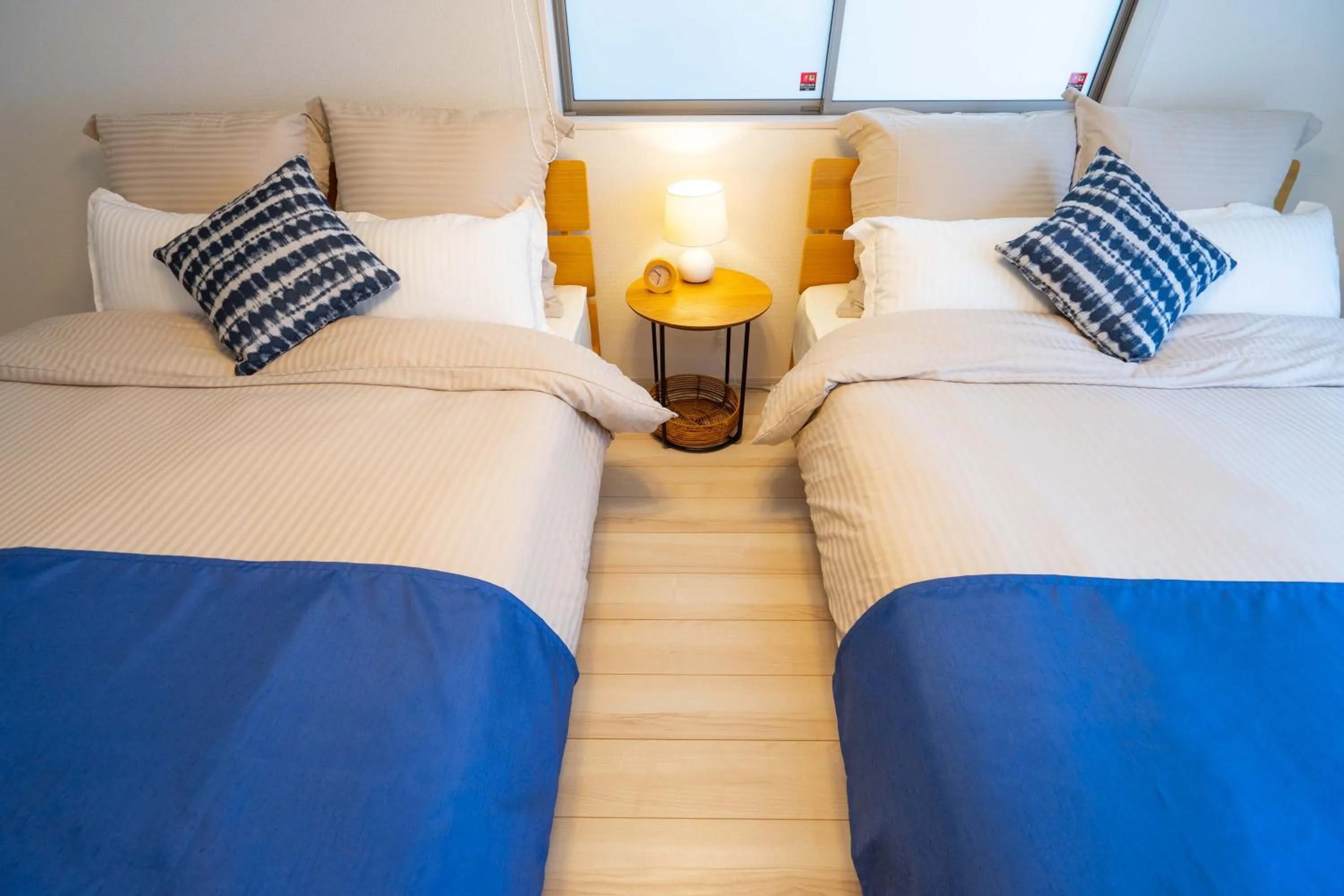 Photo of the whole room, Bed in OKINAWA BEACH HOUSE Golden Drop S