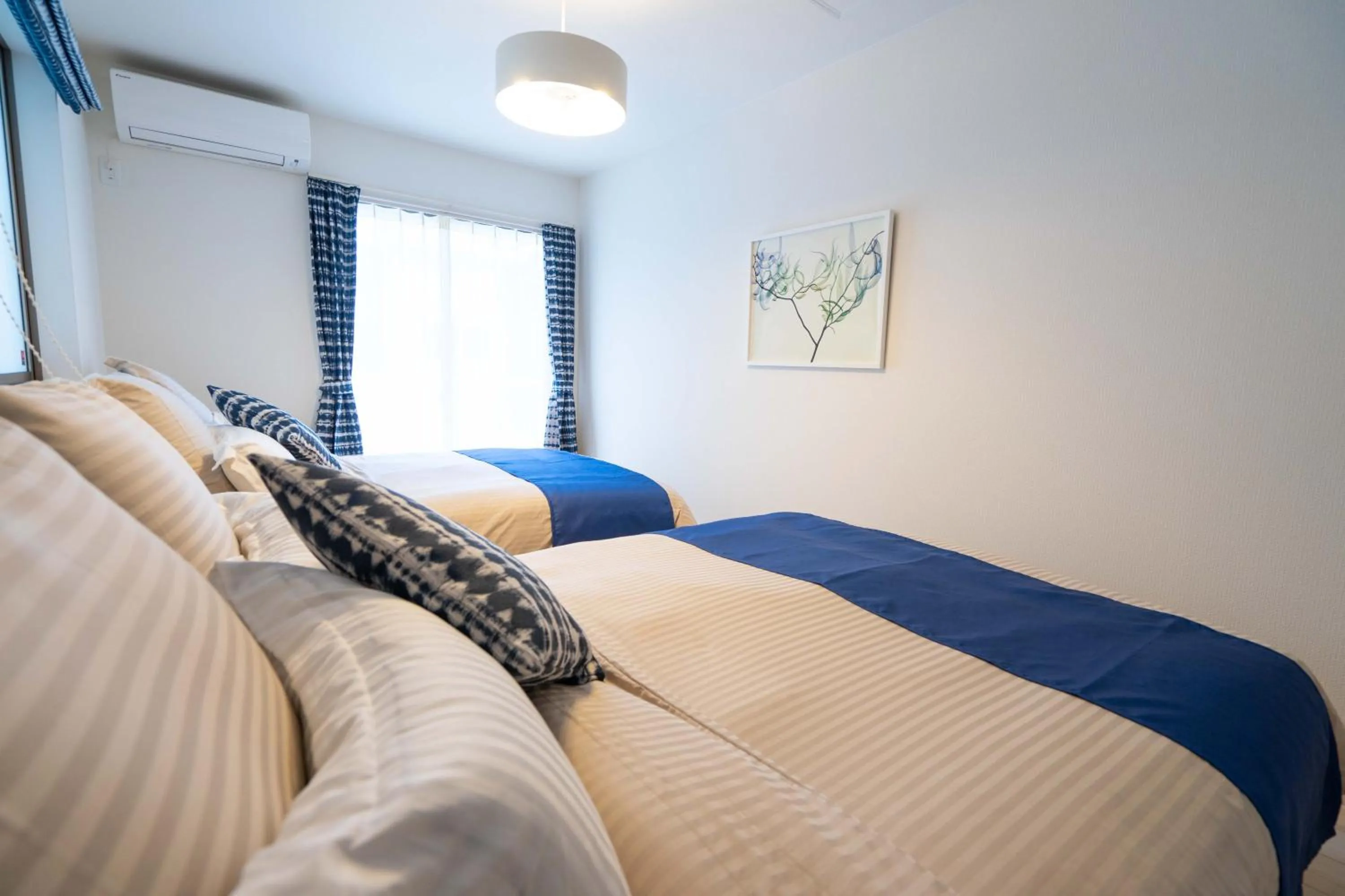 Photo of the whole room, Bed in OKINAWA BEACH HOUSE Golden Drop S