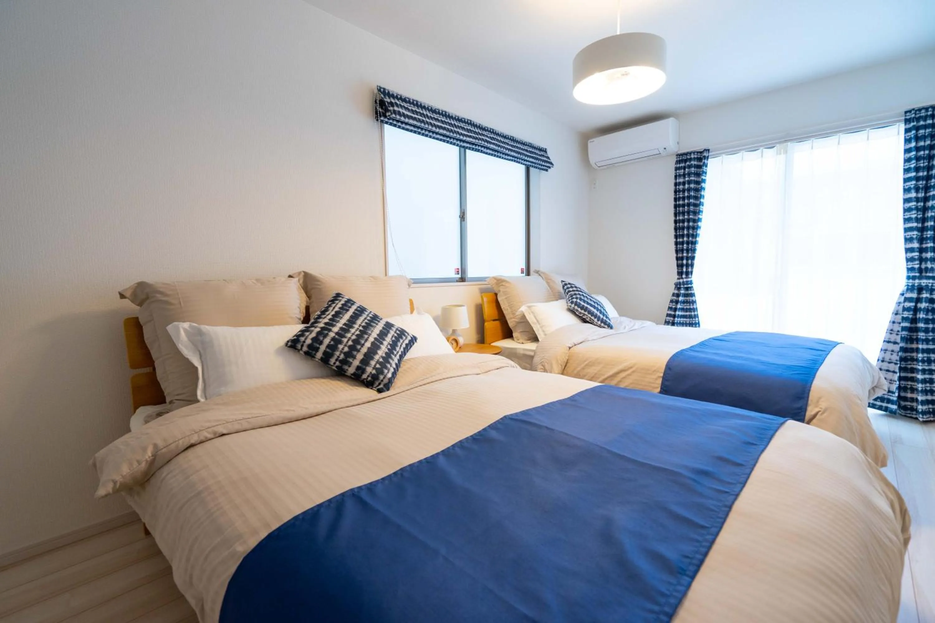 Photo of the whole room, Bed in OKINAWA BEACH HOUSE Golden Drop S