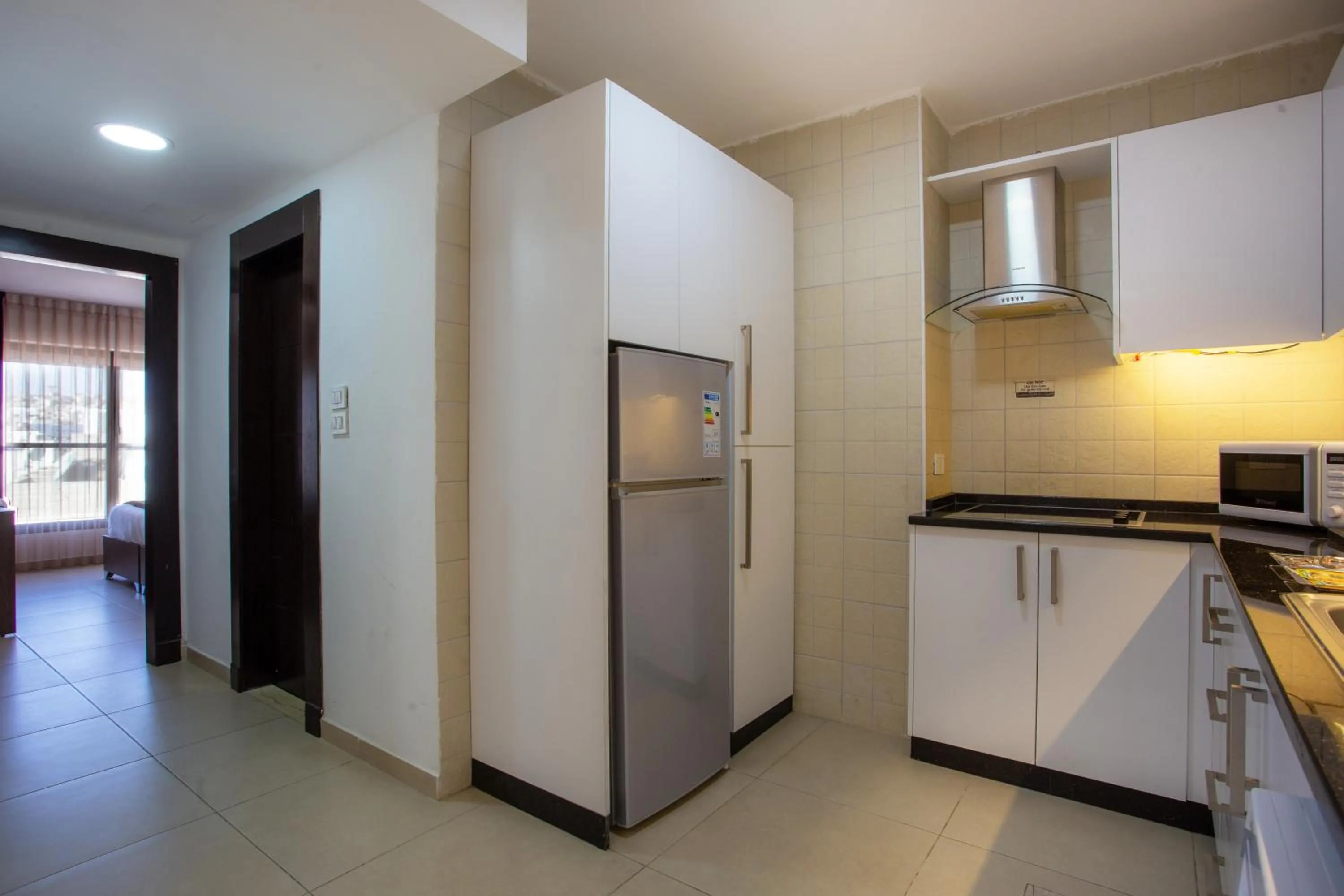 Kitchen or kitchenette in Triple A Hotel Suites