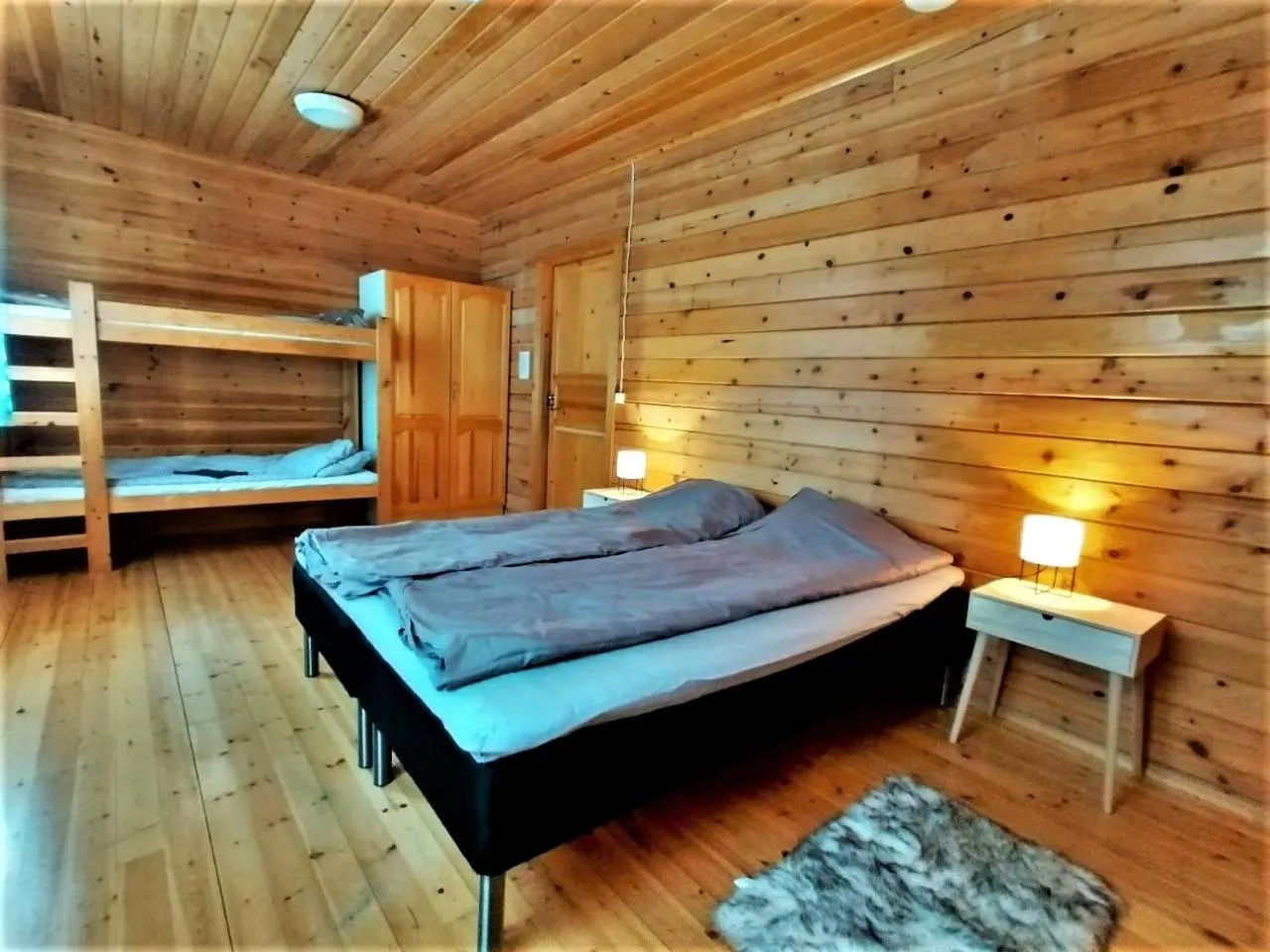 Bed in Old Pine Husky Lodge