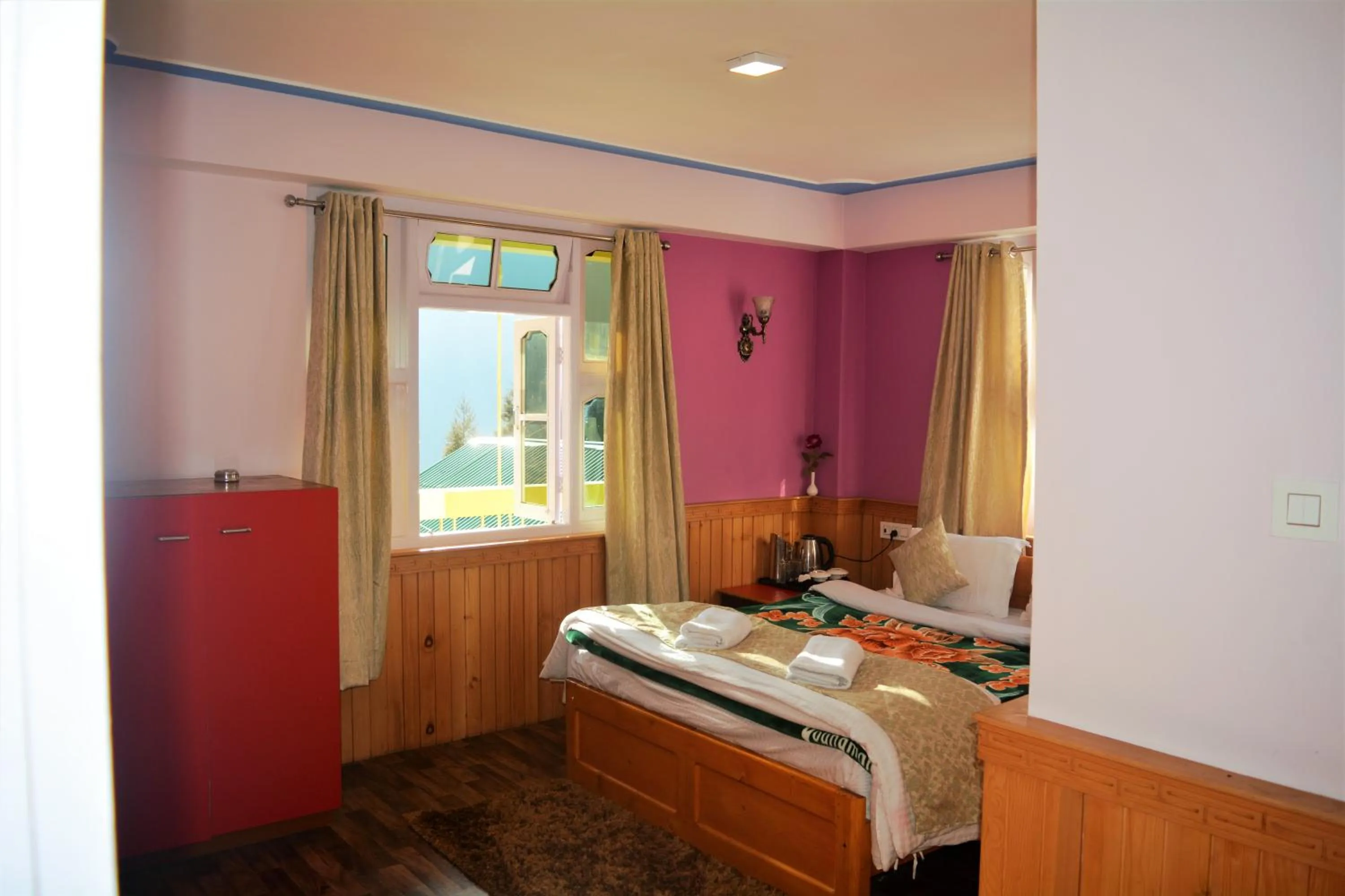 Bedroom in Rufina Lachung de'CROWN