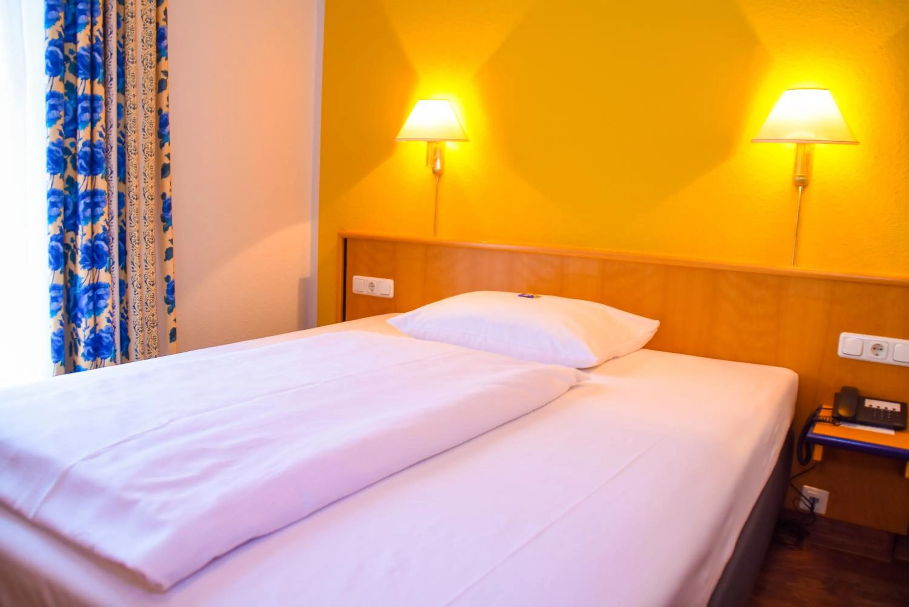 Bed in Hotel Strohofer