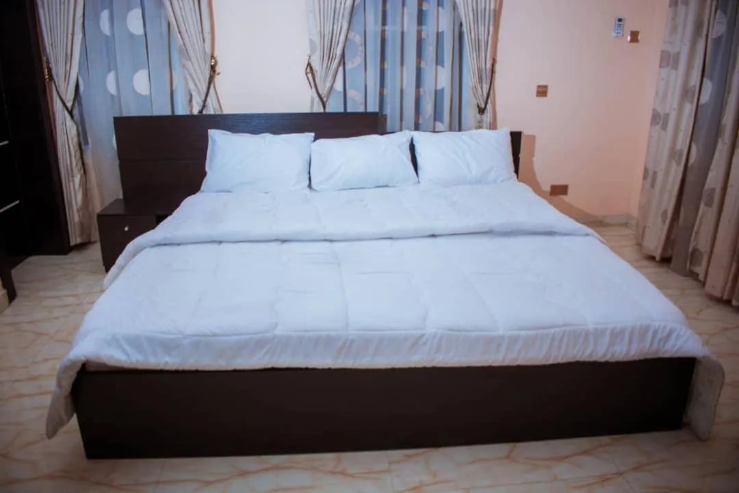 Bed in Mexiloyd Luxury Rooms & Suites