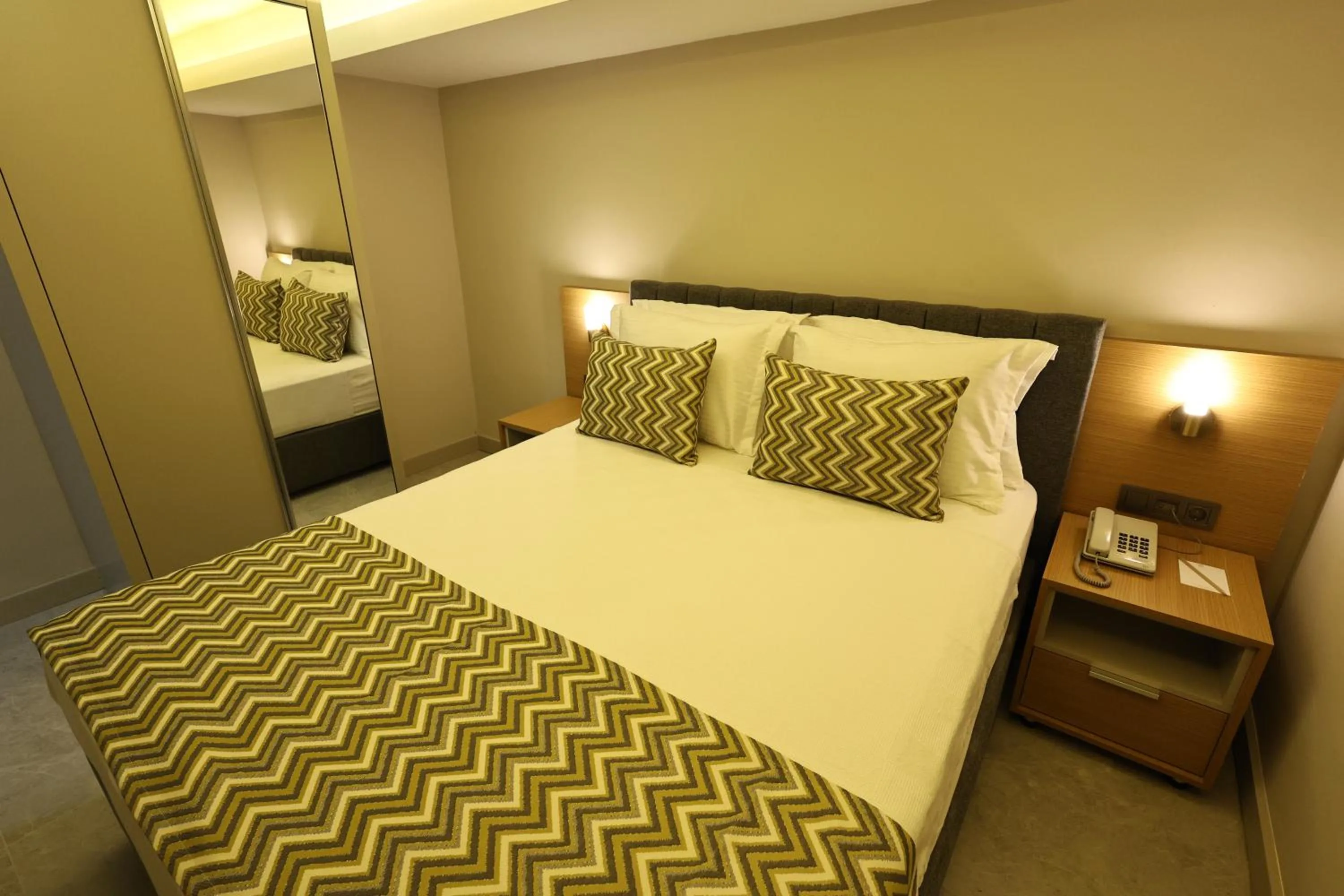 Bedroom, Bed in mustang suite hotel