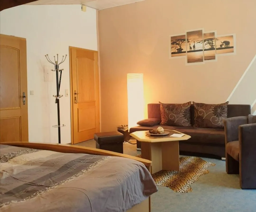 Seating area, Bed in Landhotel Heidkrug