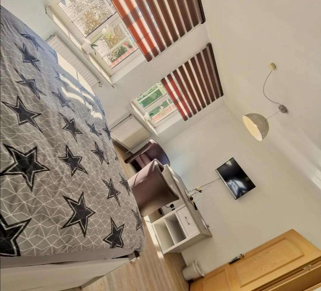 Seating area, Bed in Landhotel Heidkrug