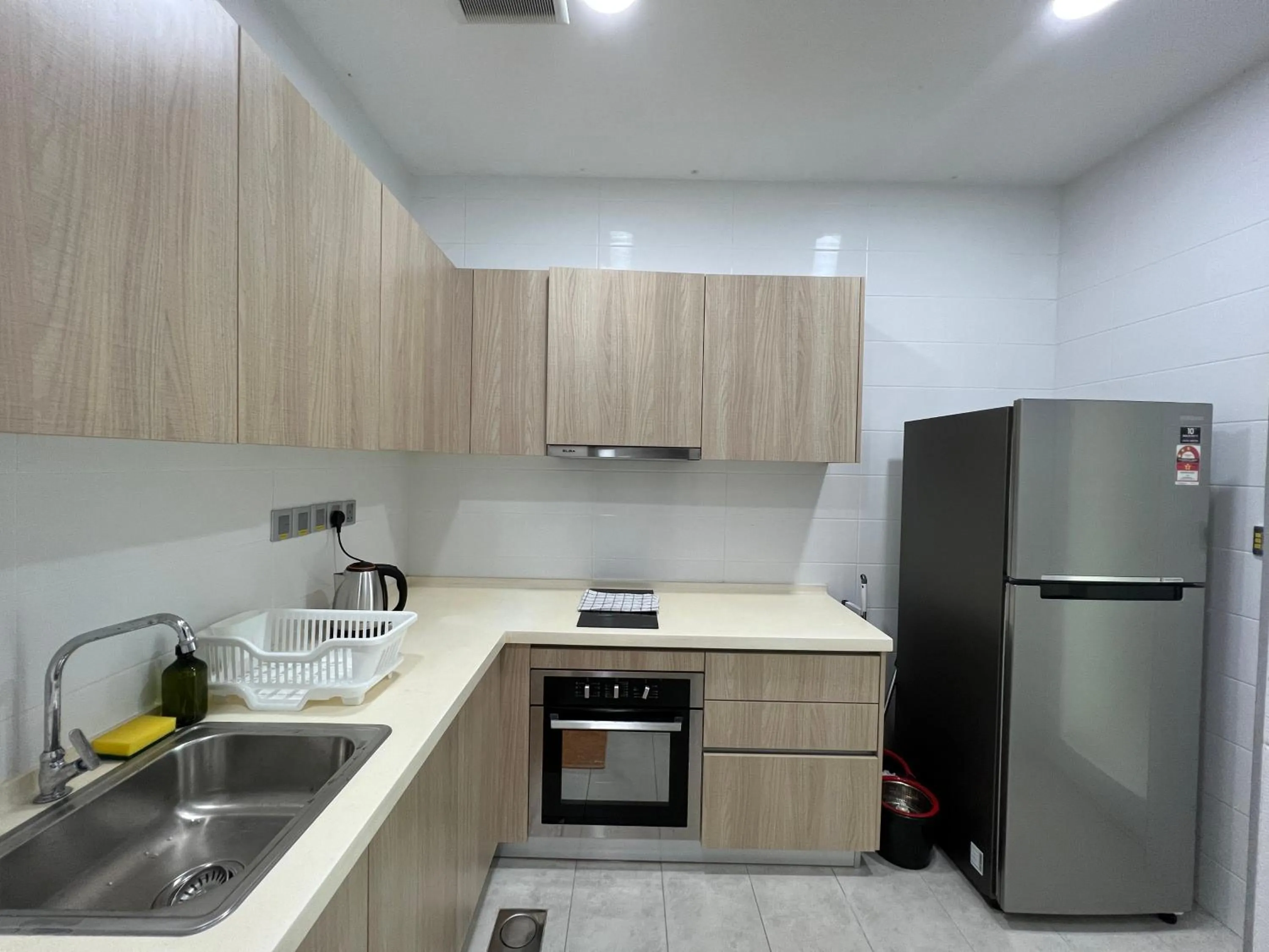Kitchen or kitchenette in Paragon Suite Homestay by Antlerzone