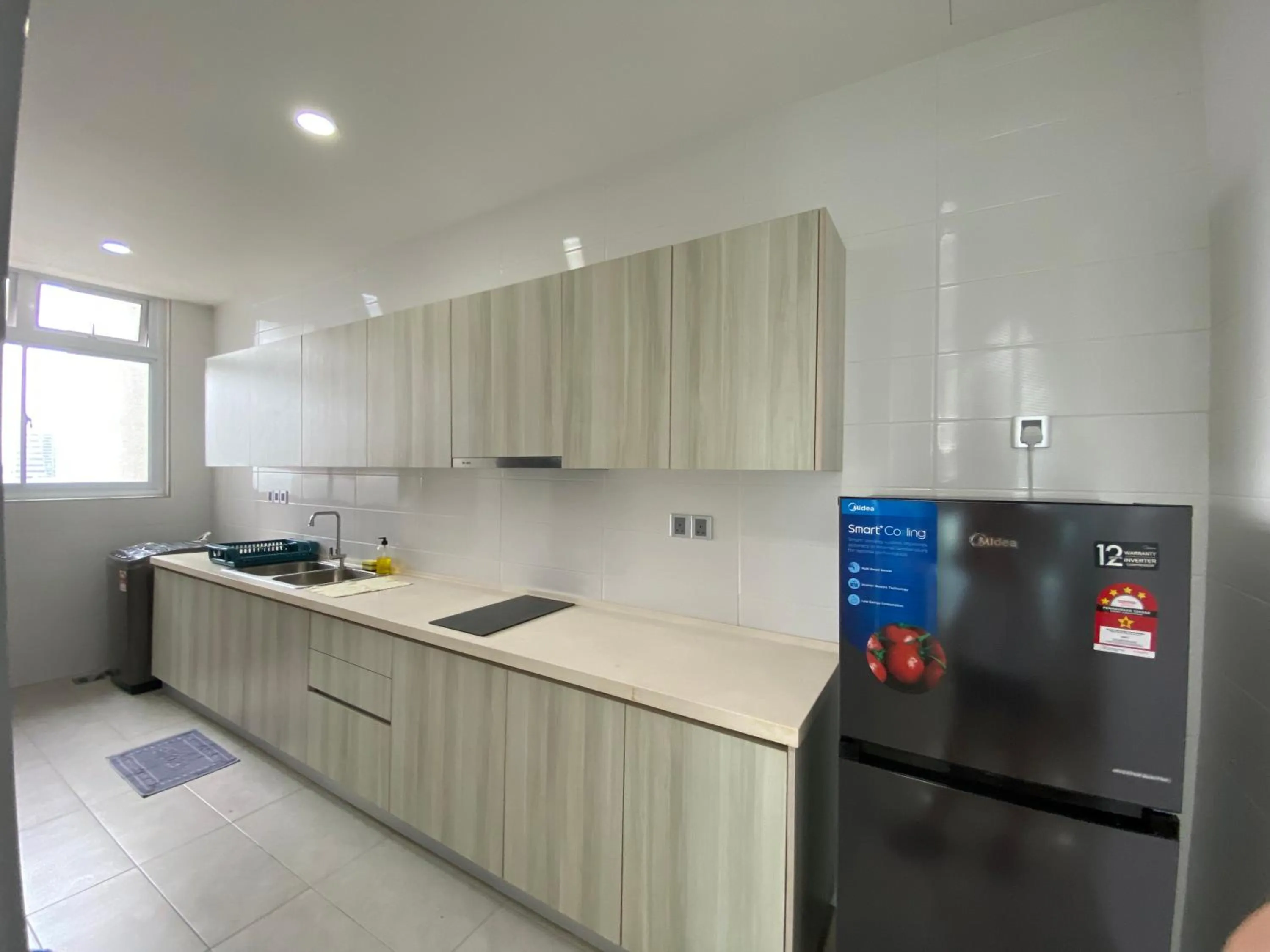 Kitchen or kitchenette in Paragon Suite Homestay by Antlerzone