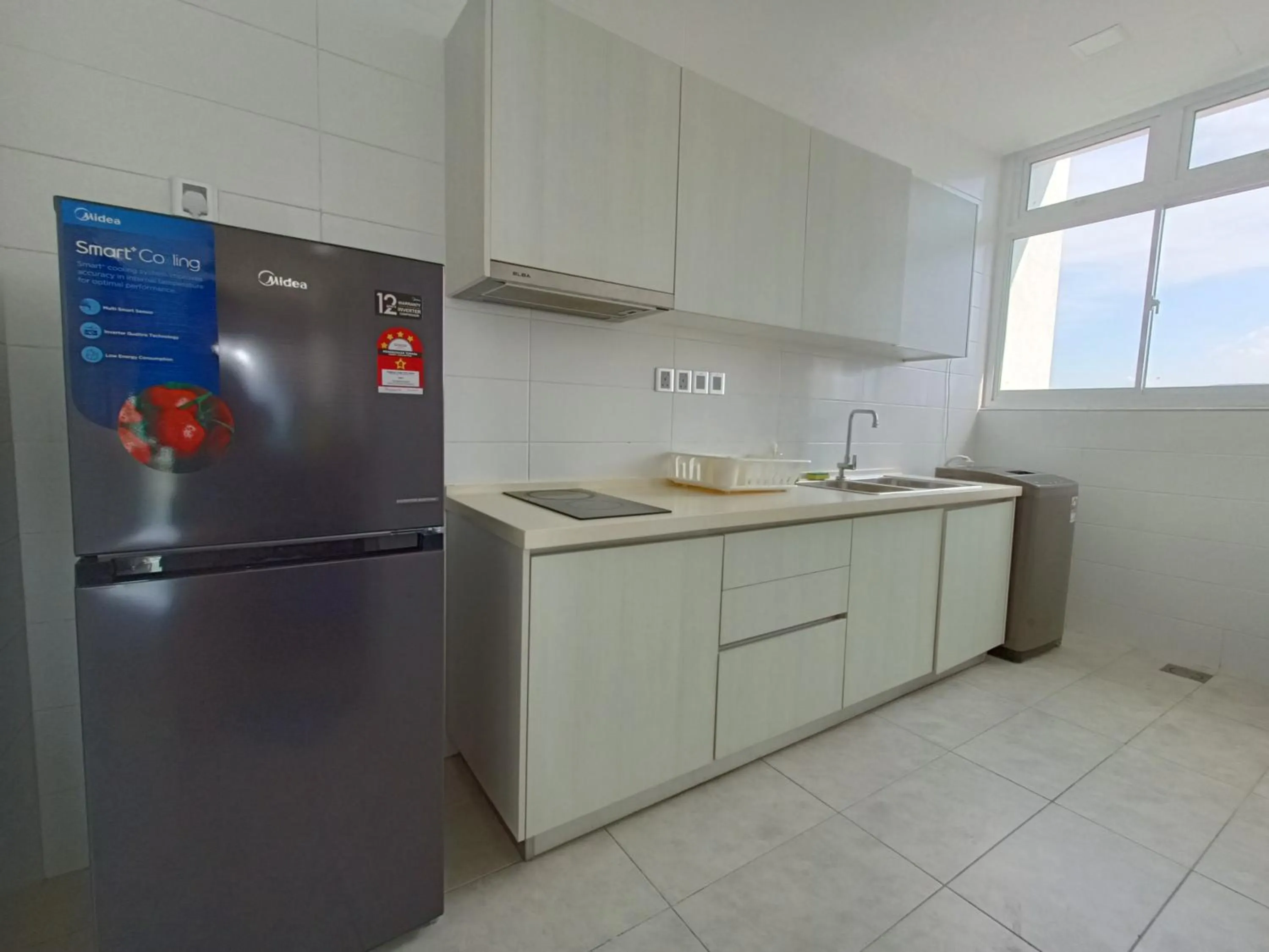 Kitchen or kitchenette in Paragon Suite Homestay by Antlerzone