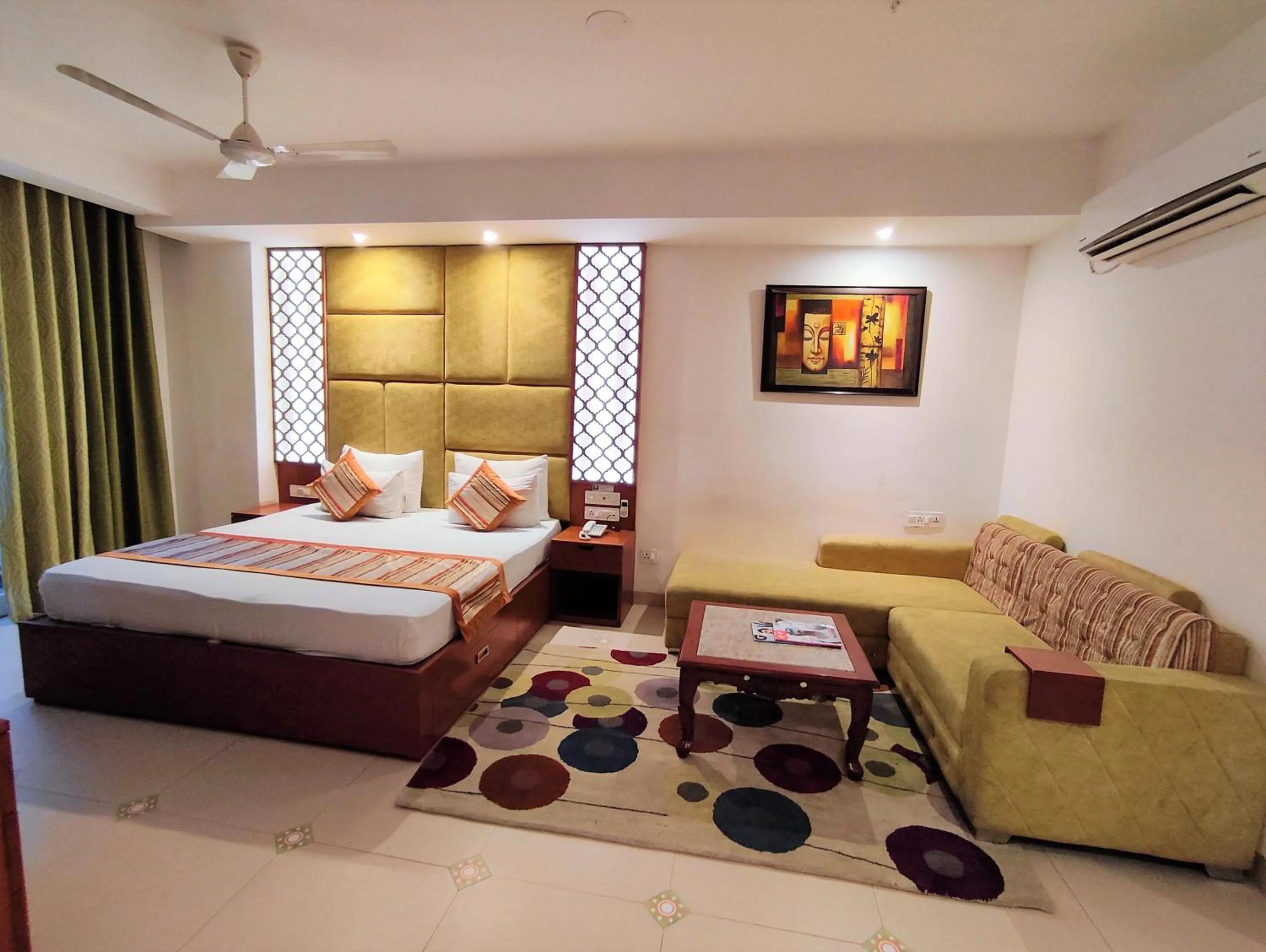 Seating area, Bed in The Angel Hotel & Suites near Medanta