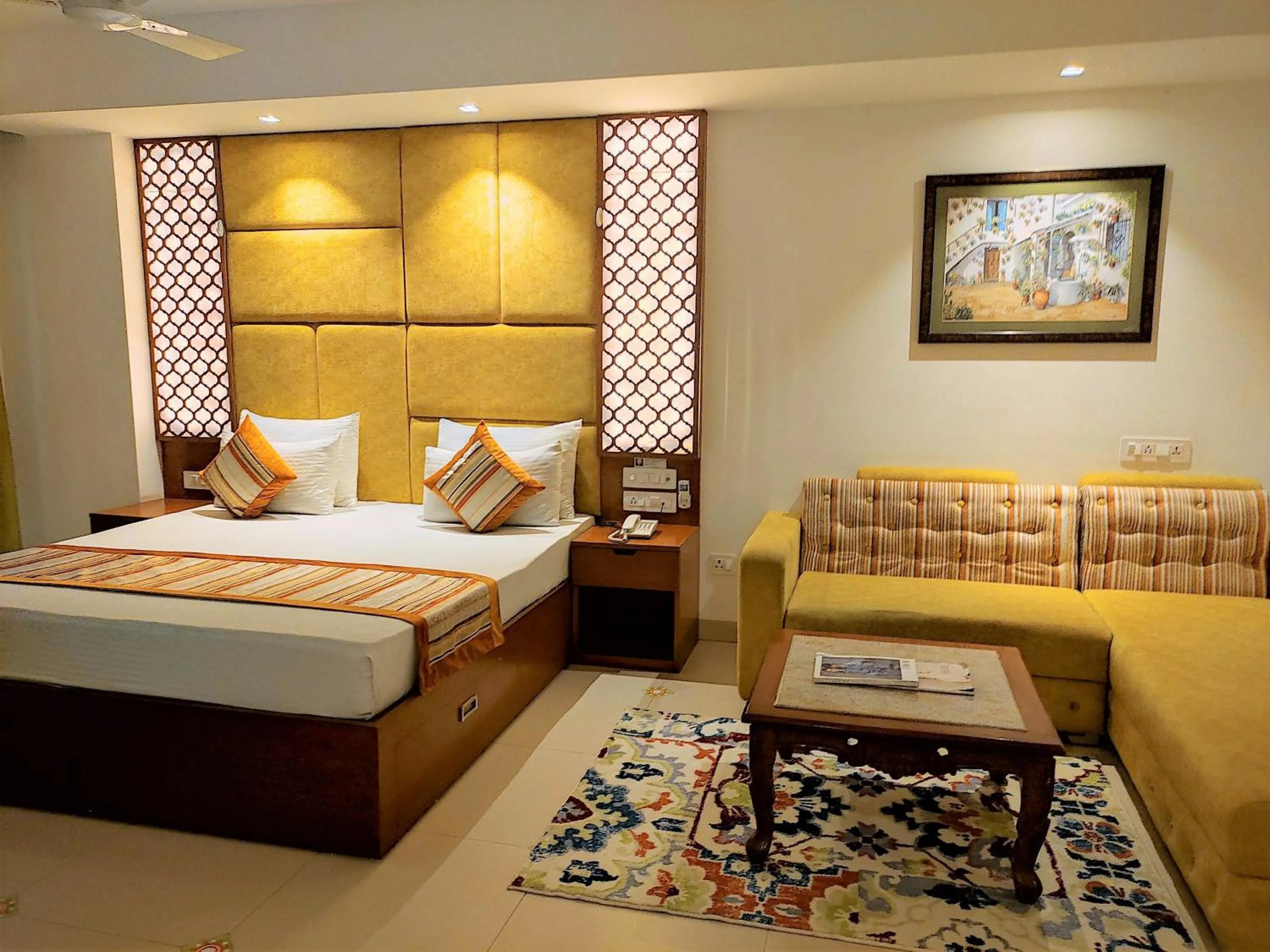 Seating area, Bed in The Angel Hotel & Suites near Medanta