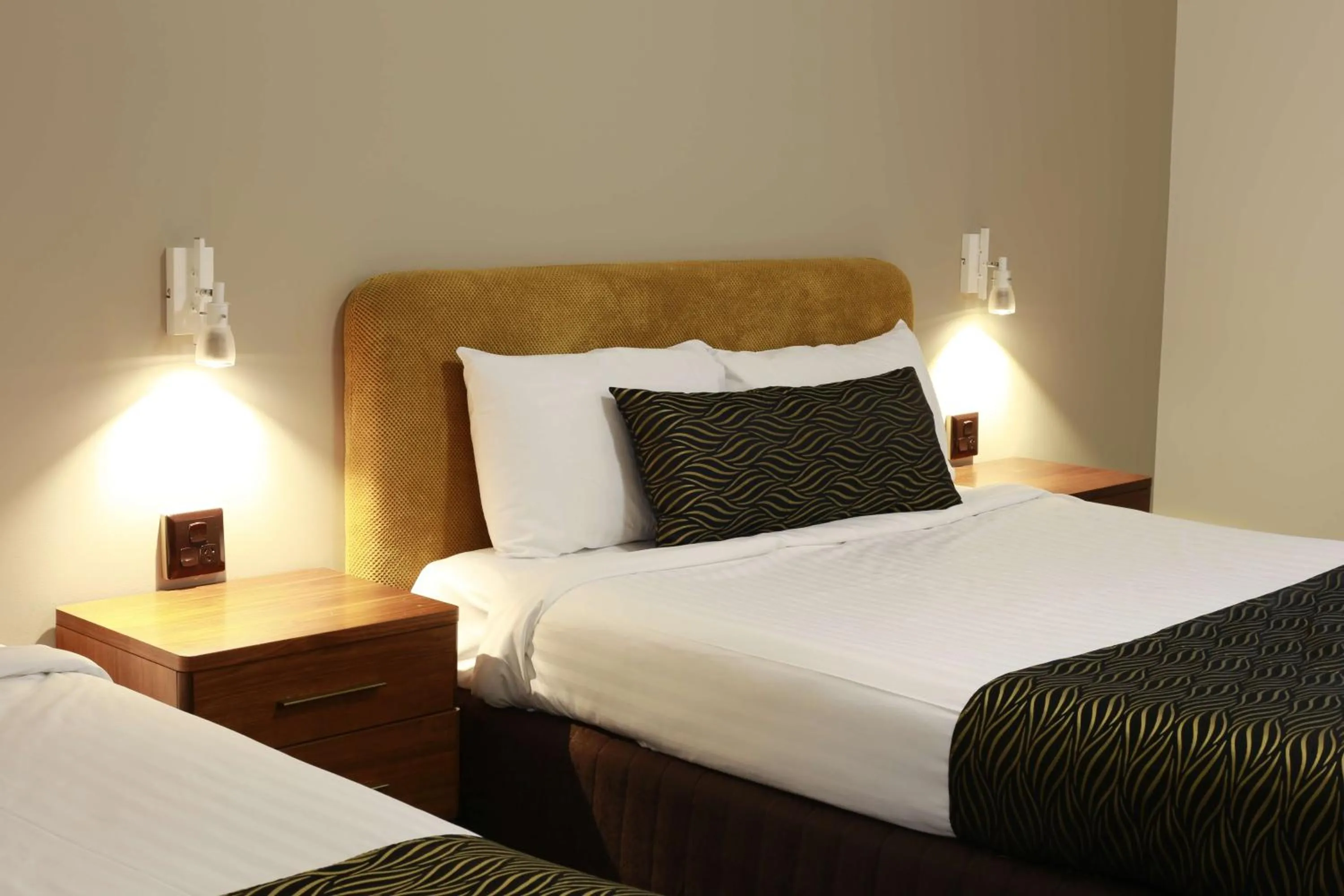 Bed in Hamilton's Queanbeyan Motel