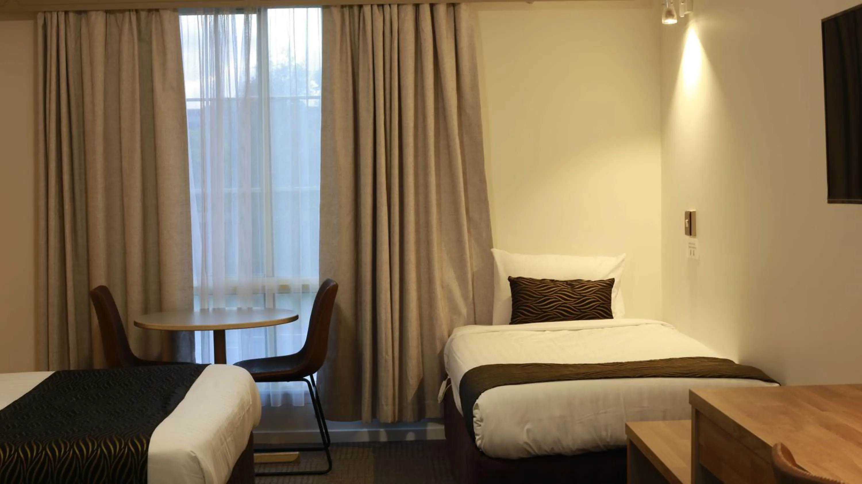 Bed in Hamilton's Queanbeyan Motel