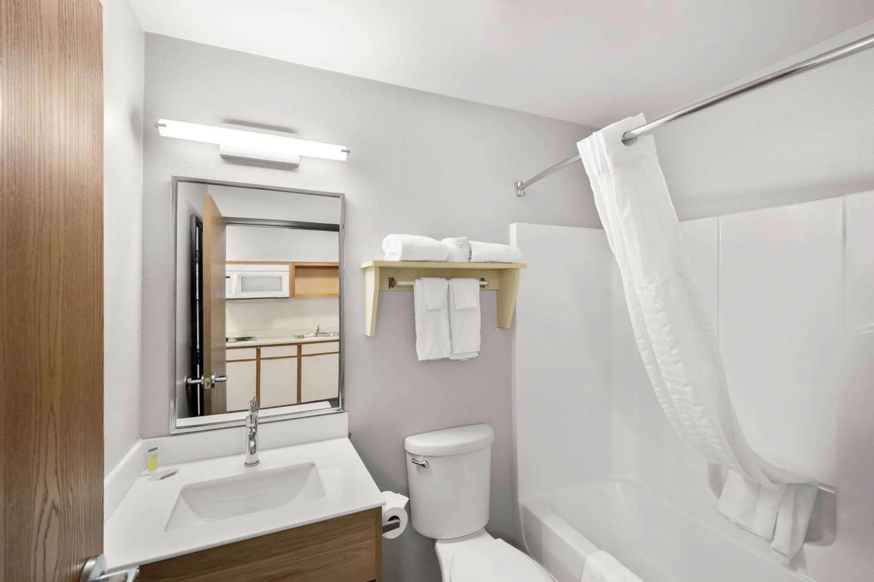 Bathroom in Days Inn & Suites by Wyndham Rochester South