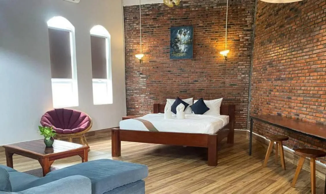 Bed in The Coconut House Hotel