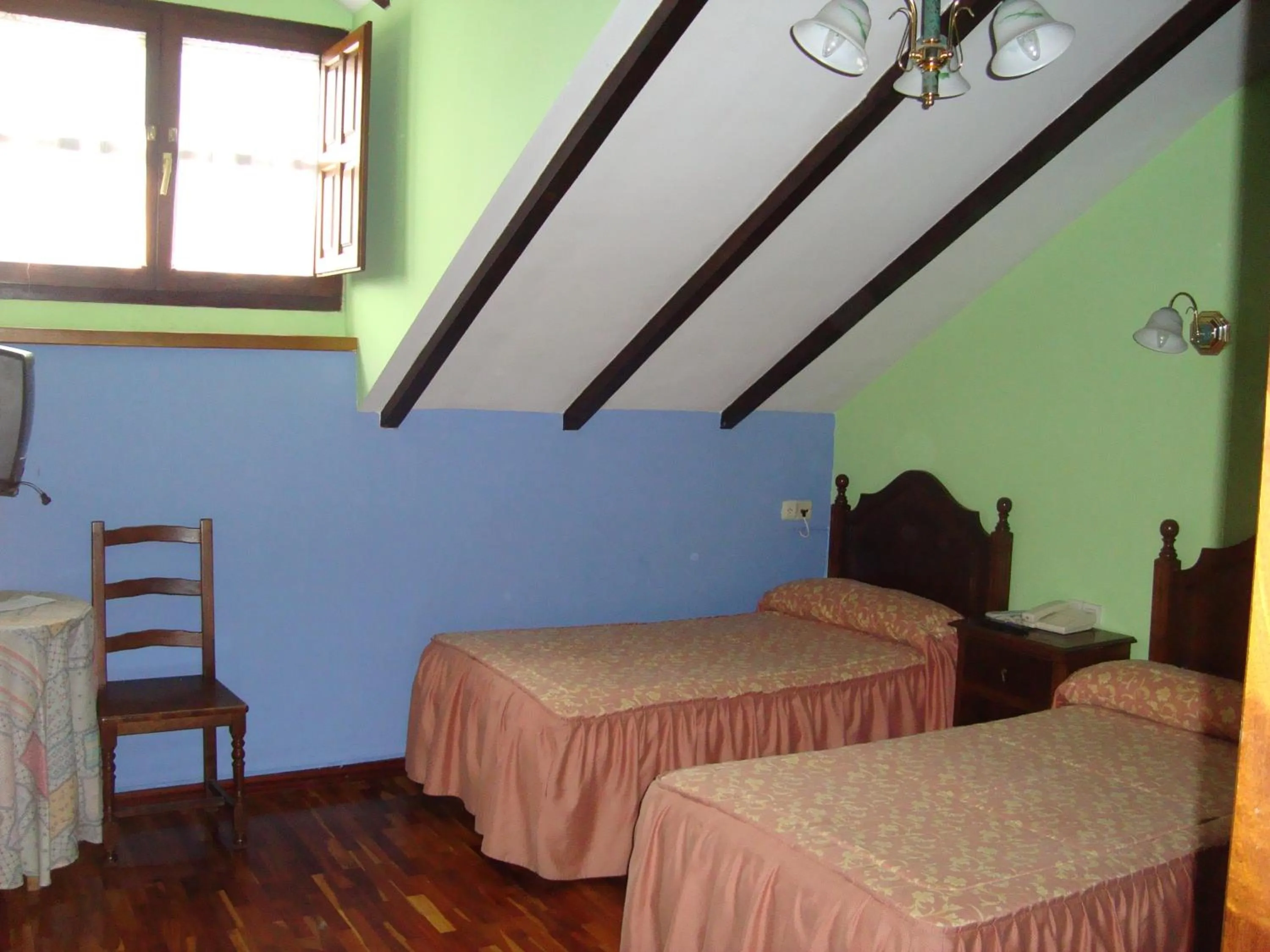 Photo of the whole room, Bed in Hosteria Peña Sagra