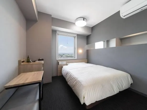 Bed in Super Hotel Mitazono Sendai Airport