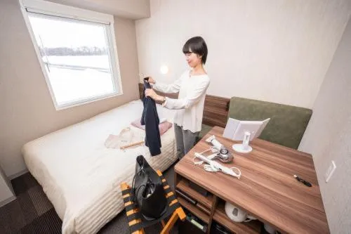 Bed in Super Hotel Mitazono Sendai Airport