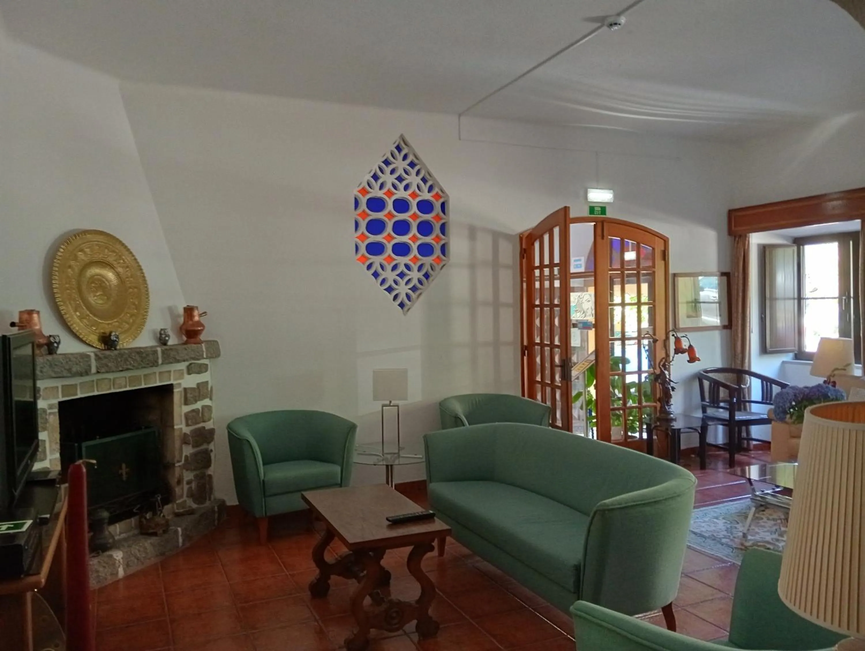 Communal lounge/ TV room in Albergaria do Lageado