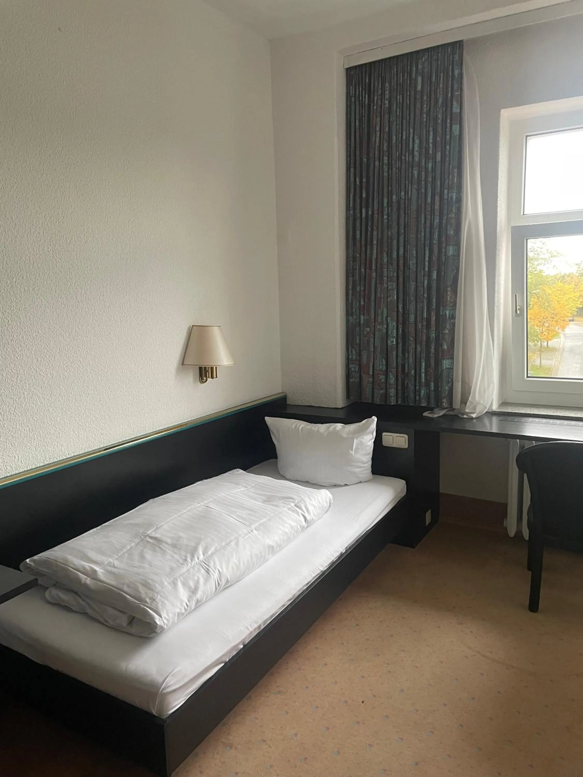 Photo of the whole room, Bed in Hotel Bitterfelder Hof