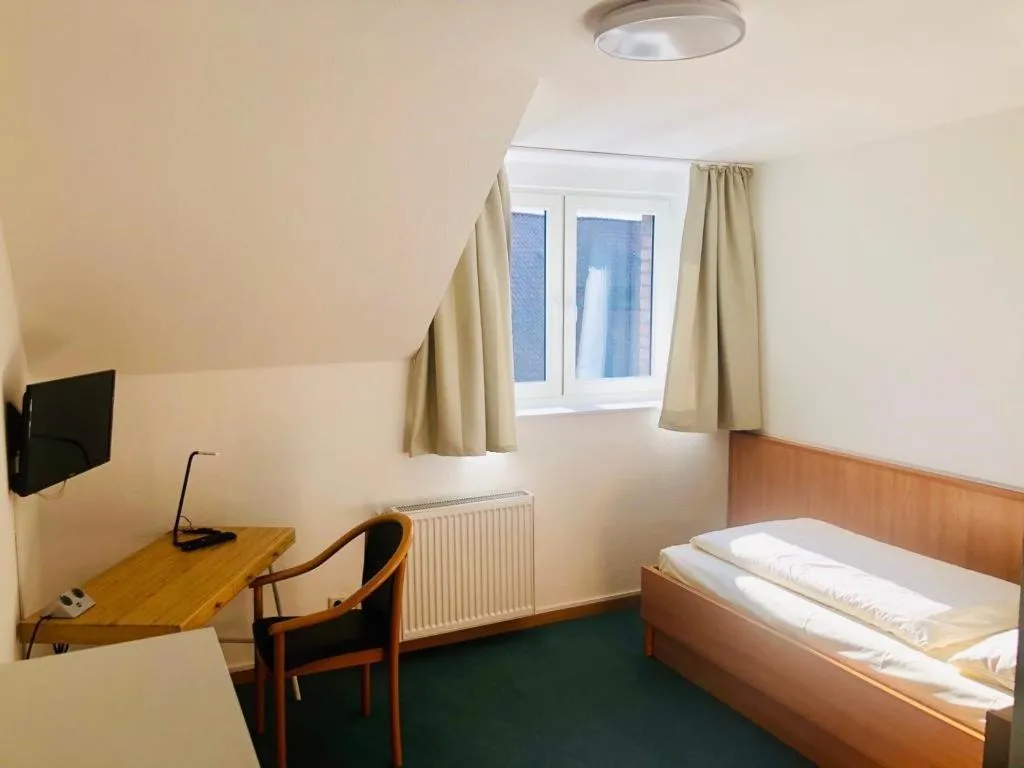 Photo of the whole room, Bed in Gästehaus Schlossgarten