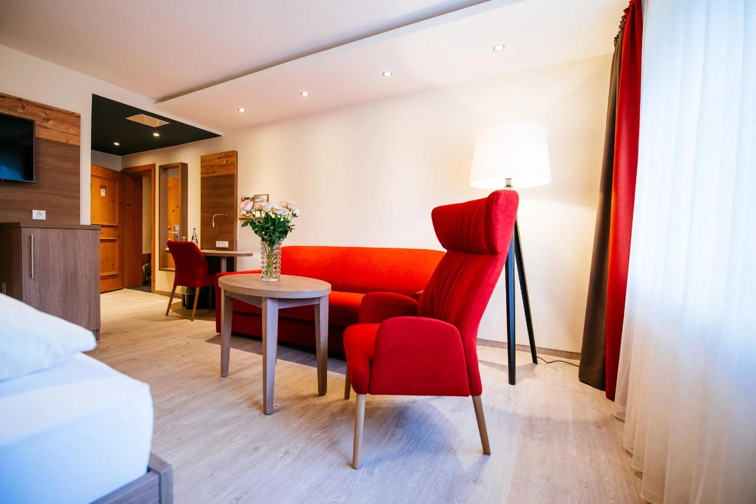 Seating area, Bed in Ringhotel Forellenhof