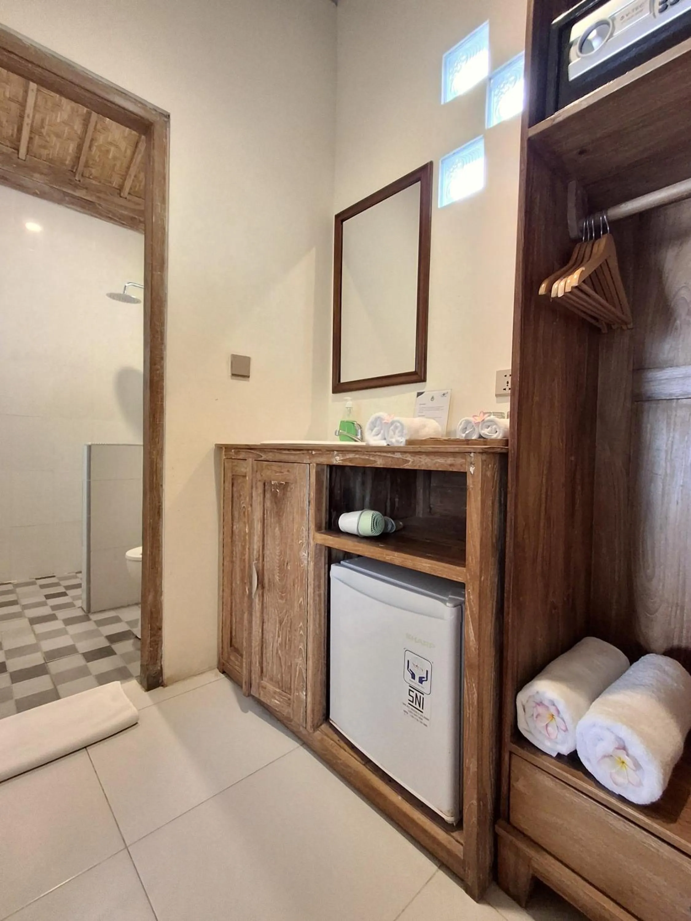 Bathroom, Bed in Blue Harbor Beachfront Villas & Resto