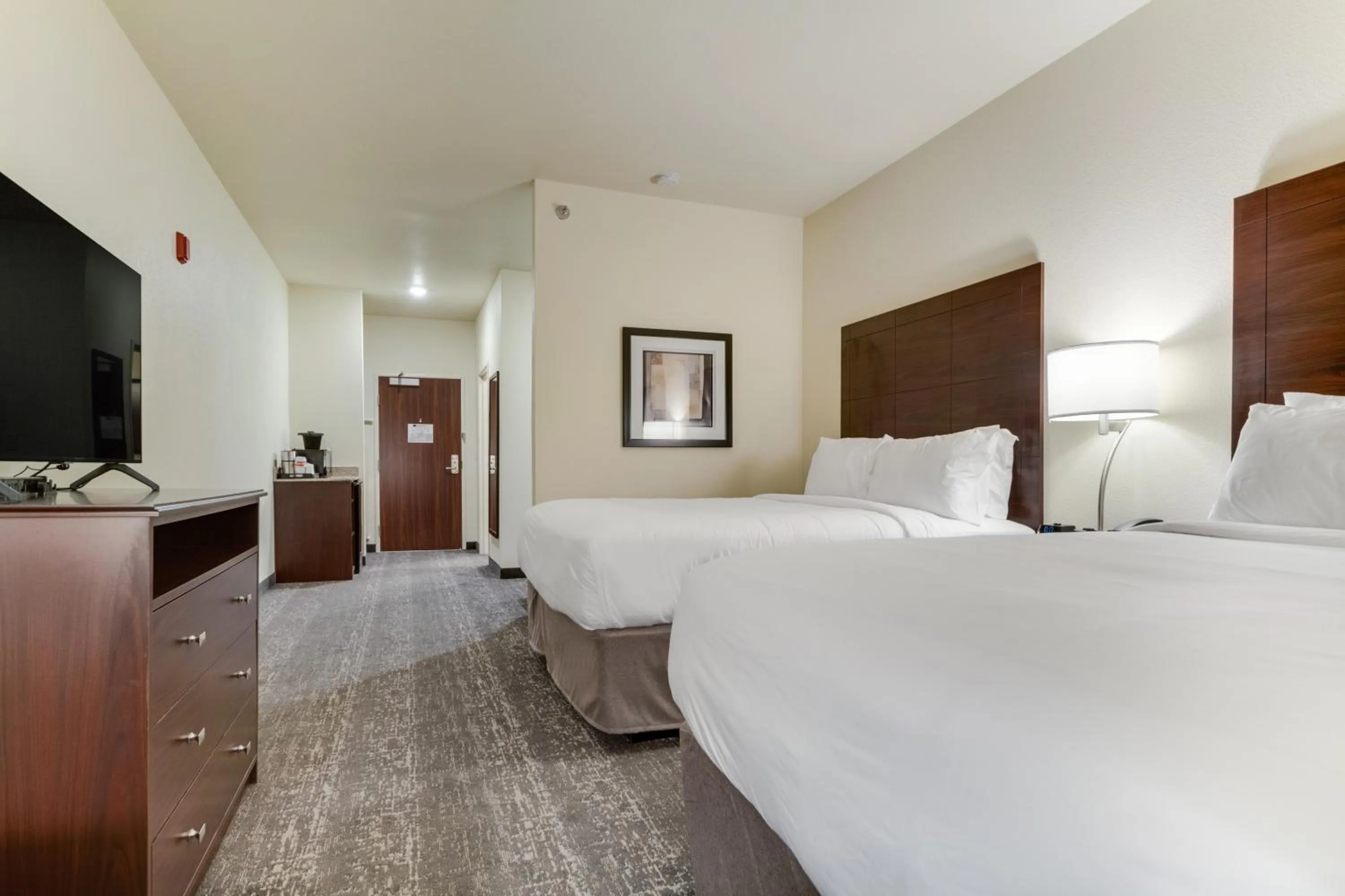 Bed in Cobblestone Hotel & Suites - Cozad