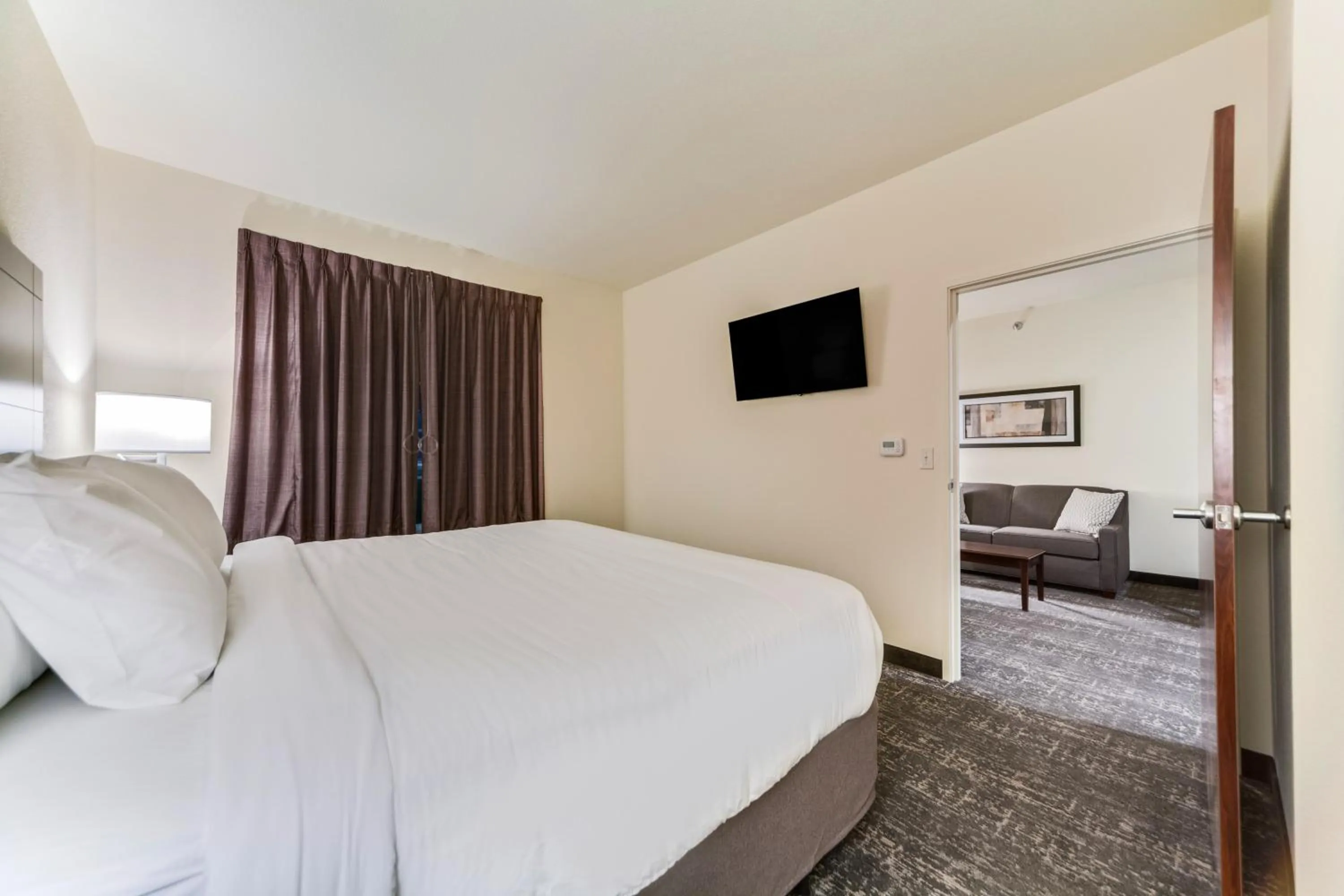 Bed in Cobblestone Hotel & Suites - Cozad