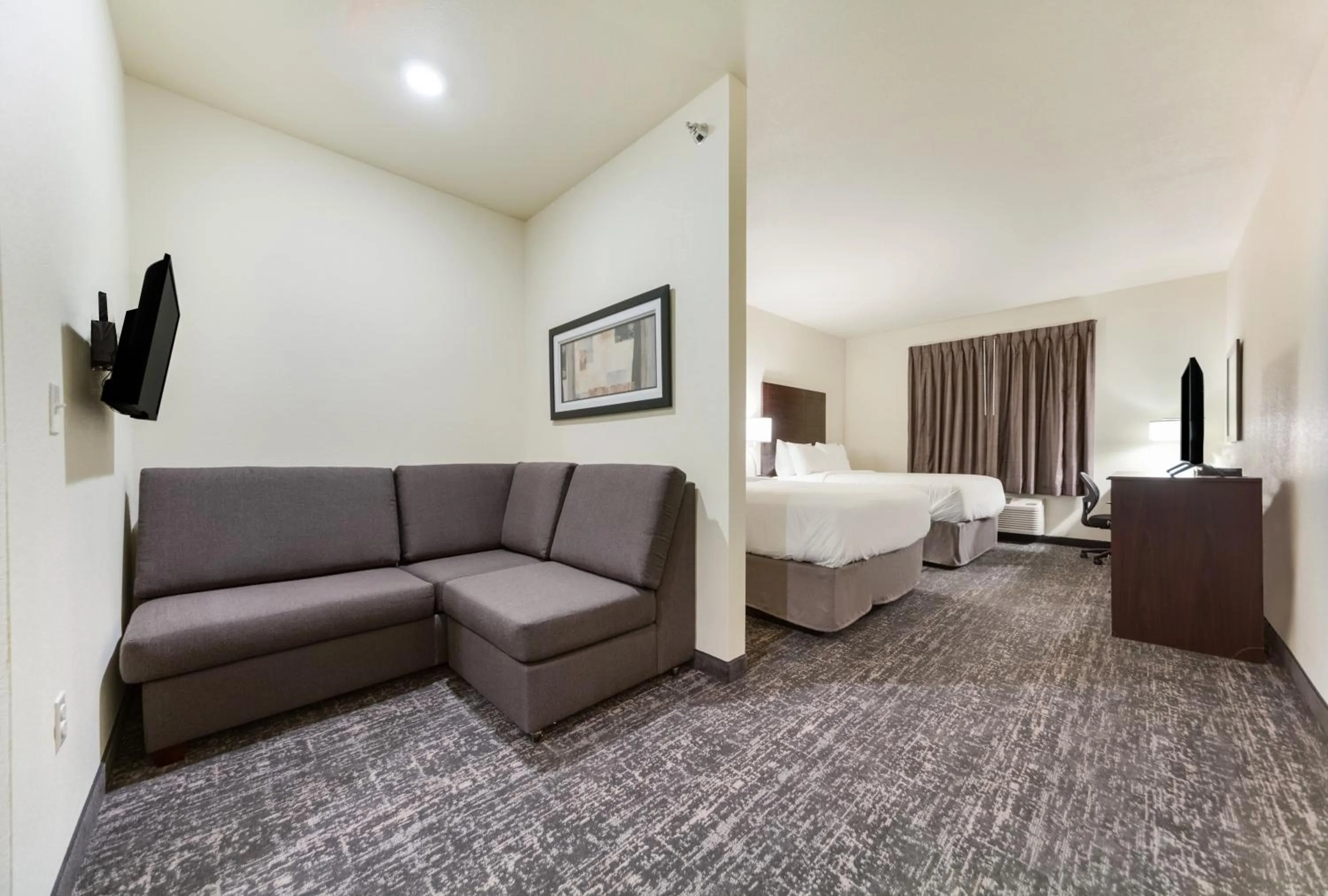 Bed in Cobblestone Hotel & Suites - Cozad
