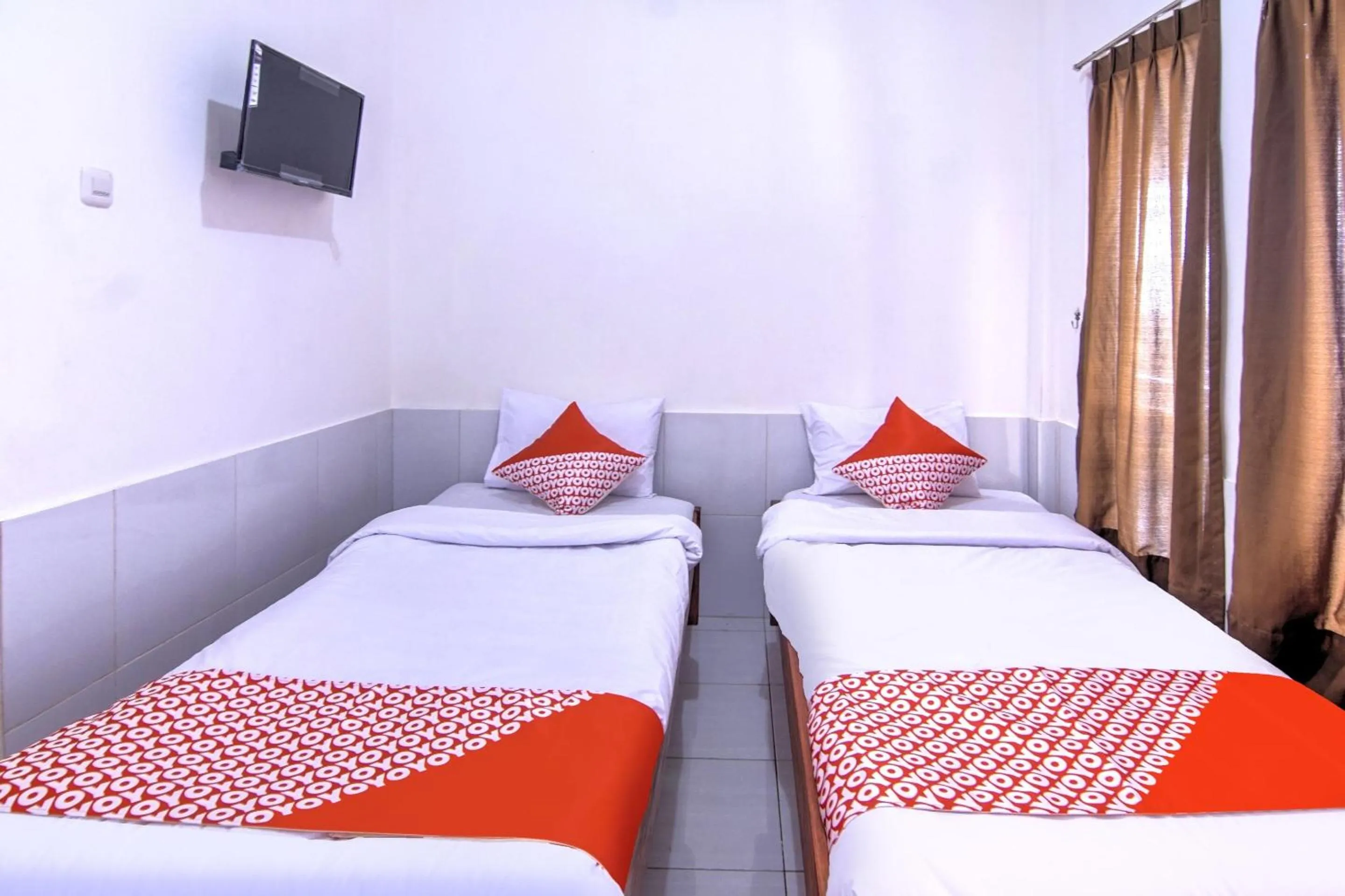 Bedroom in OYO 3317 Maju Jaya Homestay Syariah