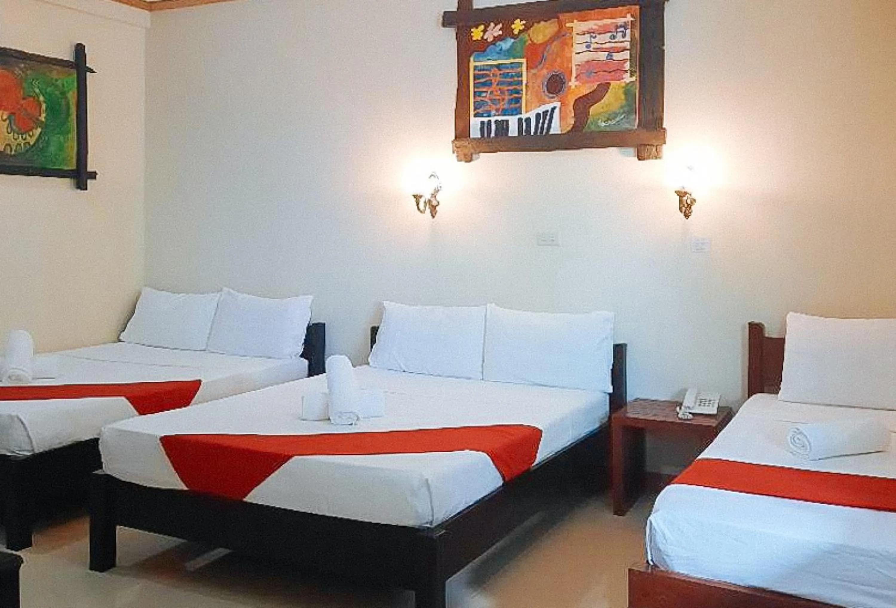 Bed in RedDoorz at New Casamila Hotel Palawan