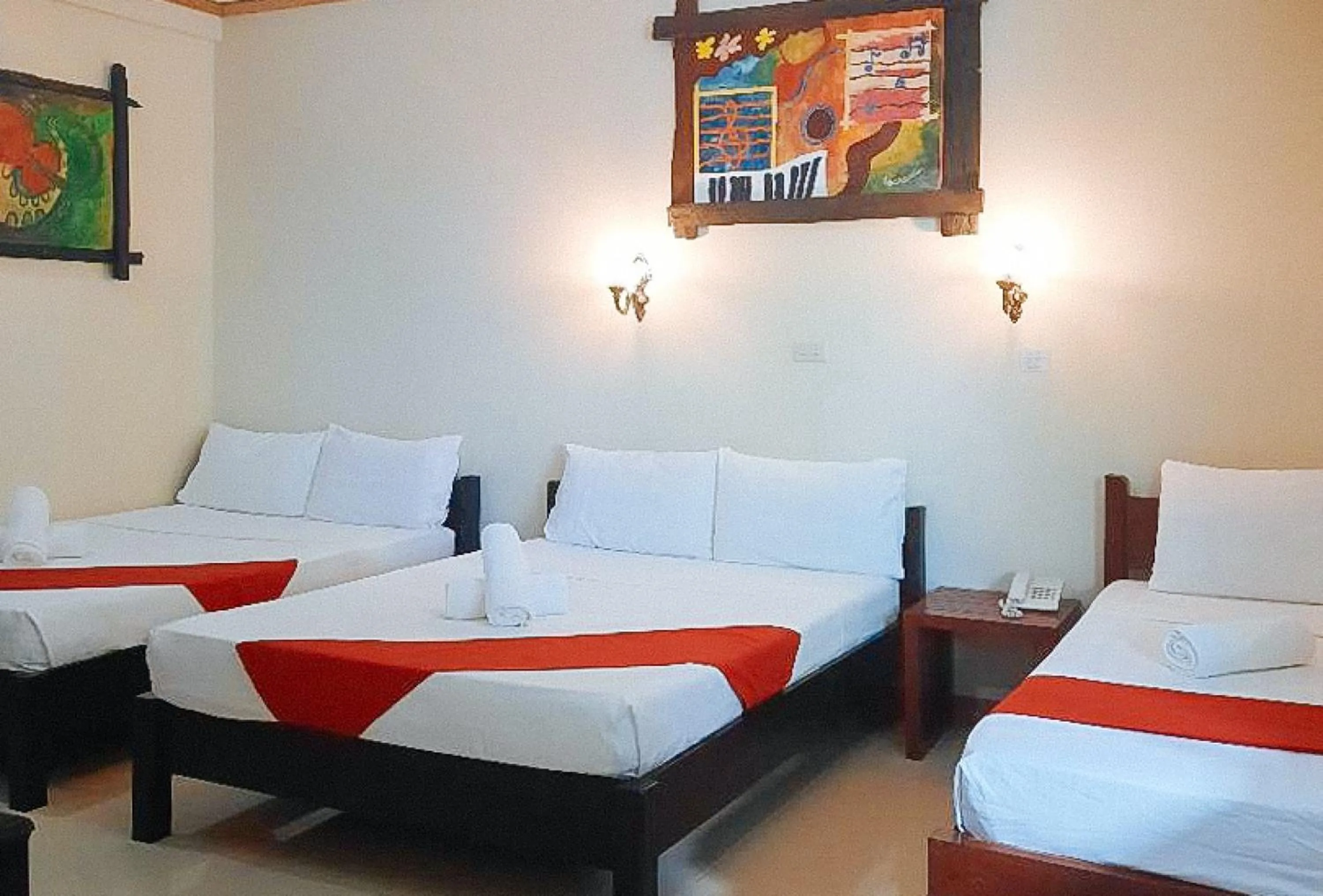Bed in RedDoorz at New Casamila Hotel Palawan