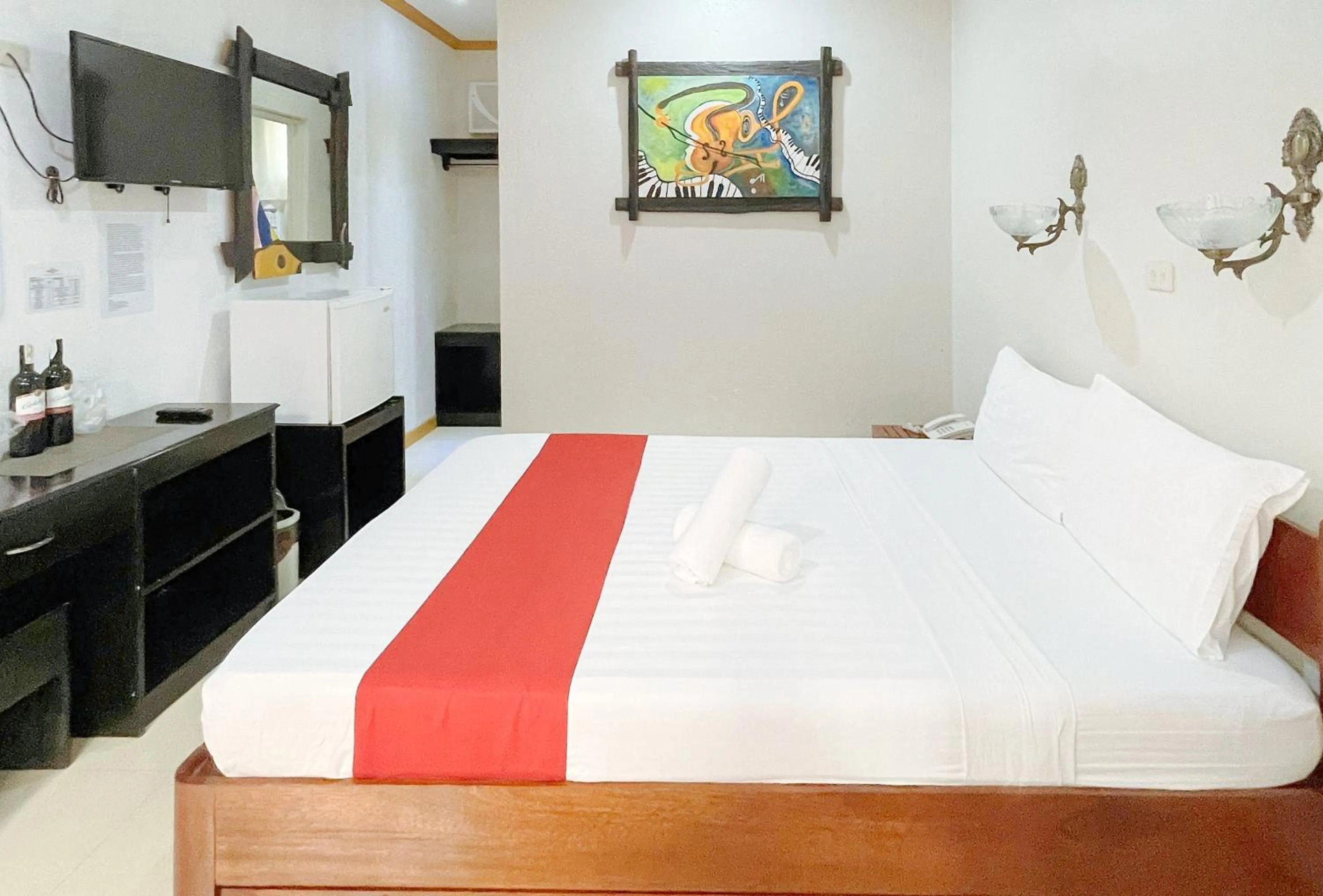 TV and multimedia in RedDoorz at New Casamila Hotel Palawan