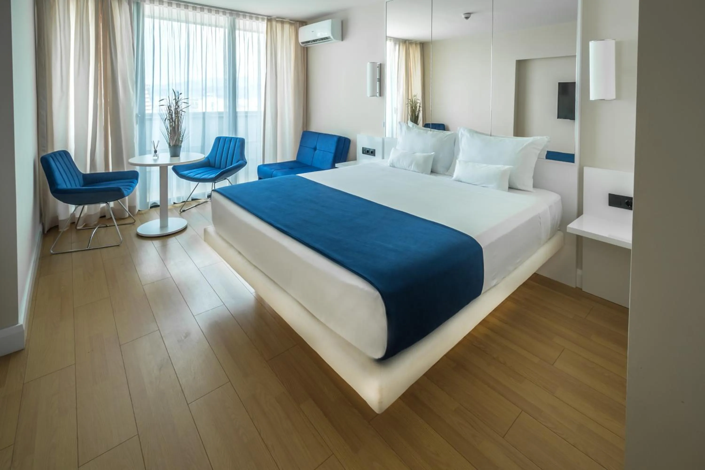 Living room, Bed in Orbi City Hotel Official