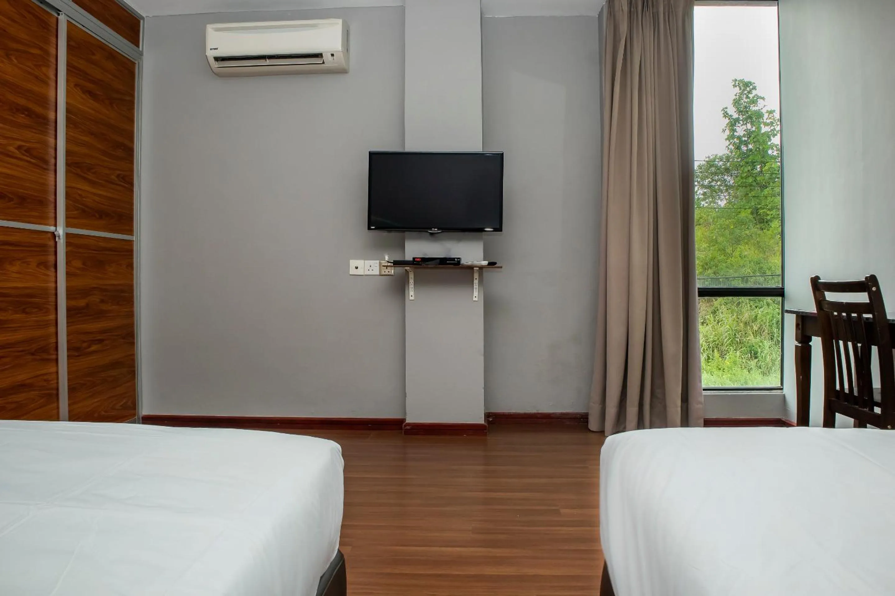 Bedroom in Hotel O Ltk Home