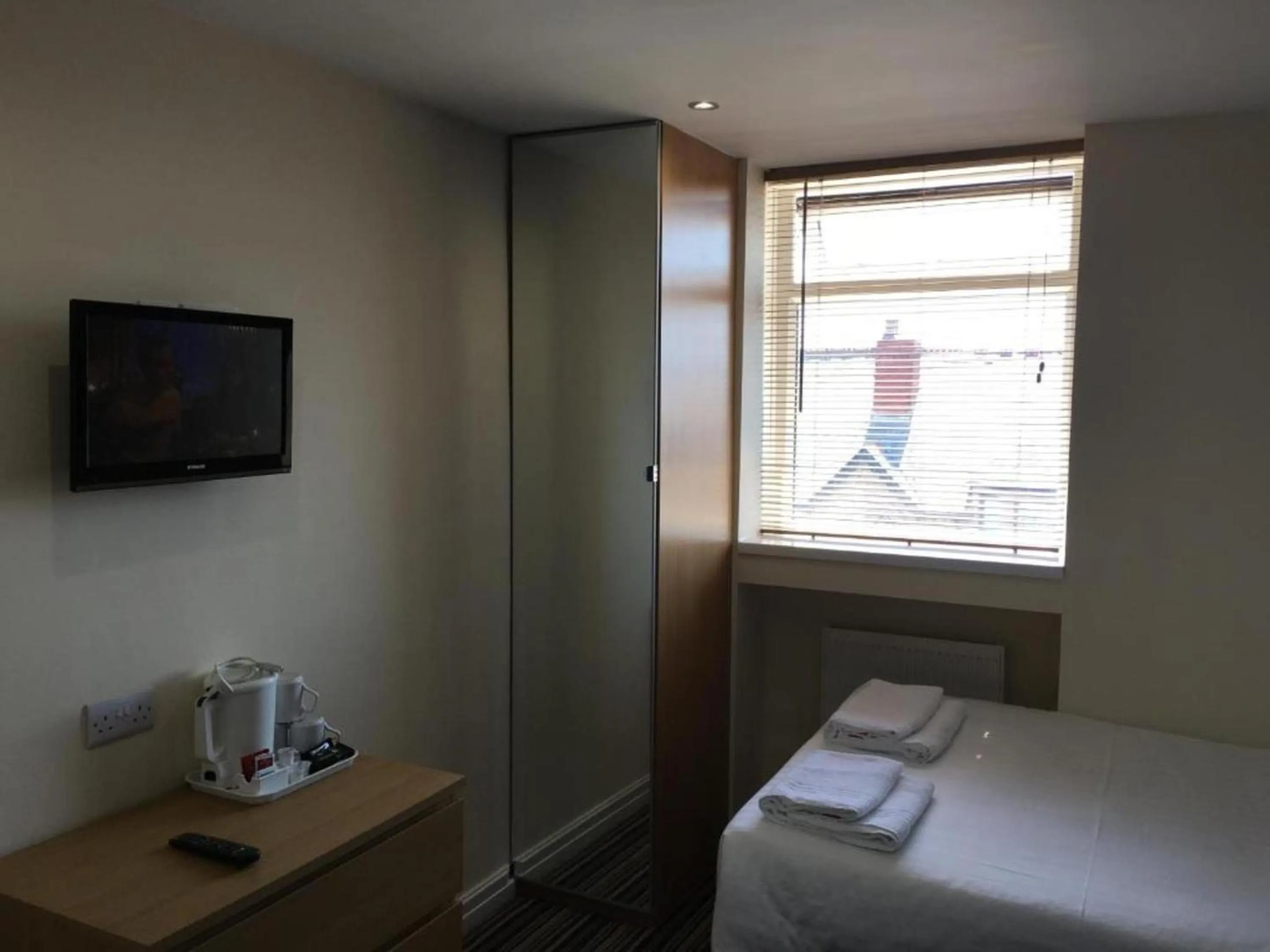 Bed in OYO Wave Crest Hotel