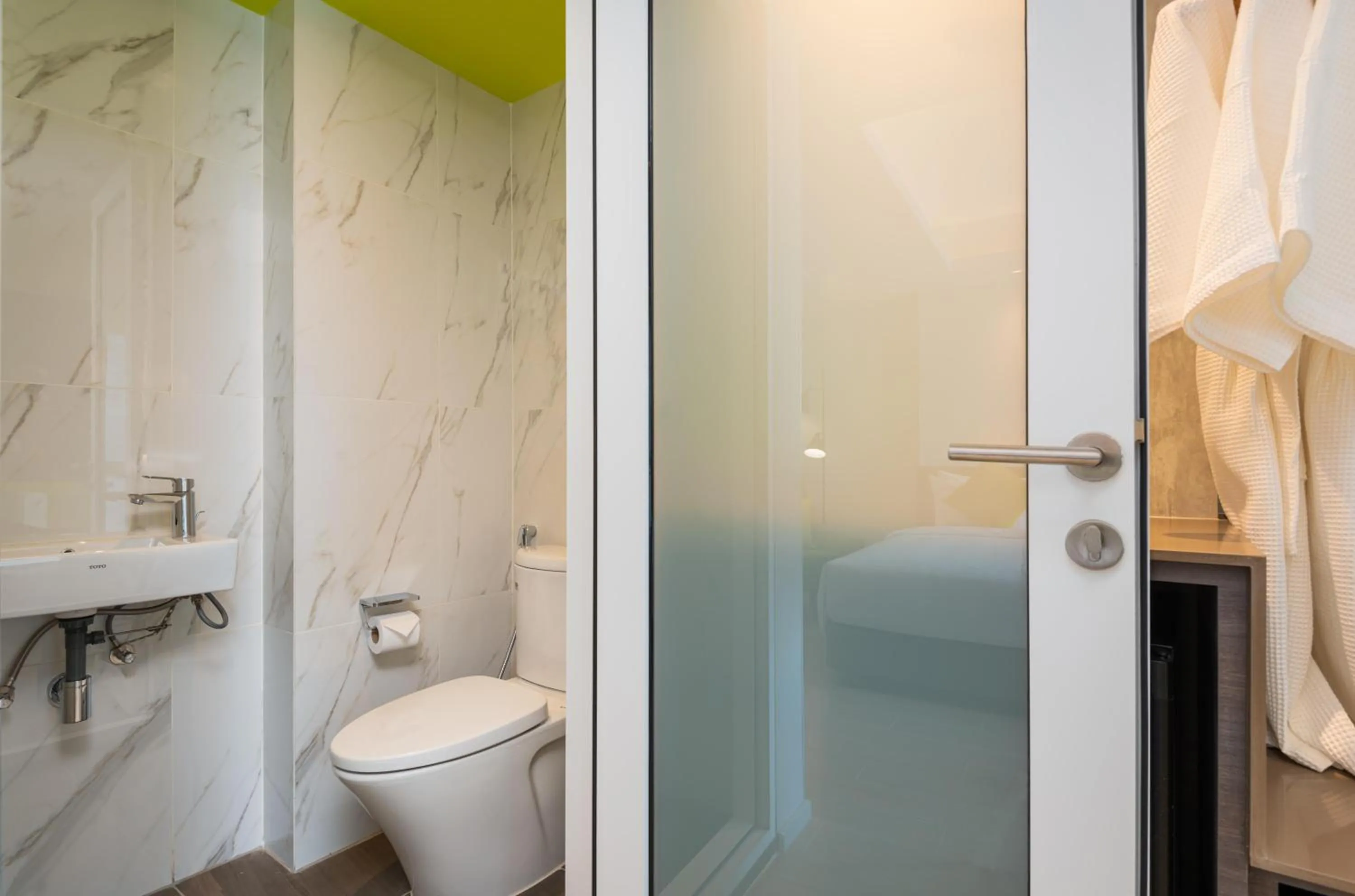 Toilet in Maitria Hotel Rama 9 Bangkok - A Chatrium Collection