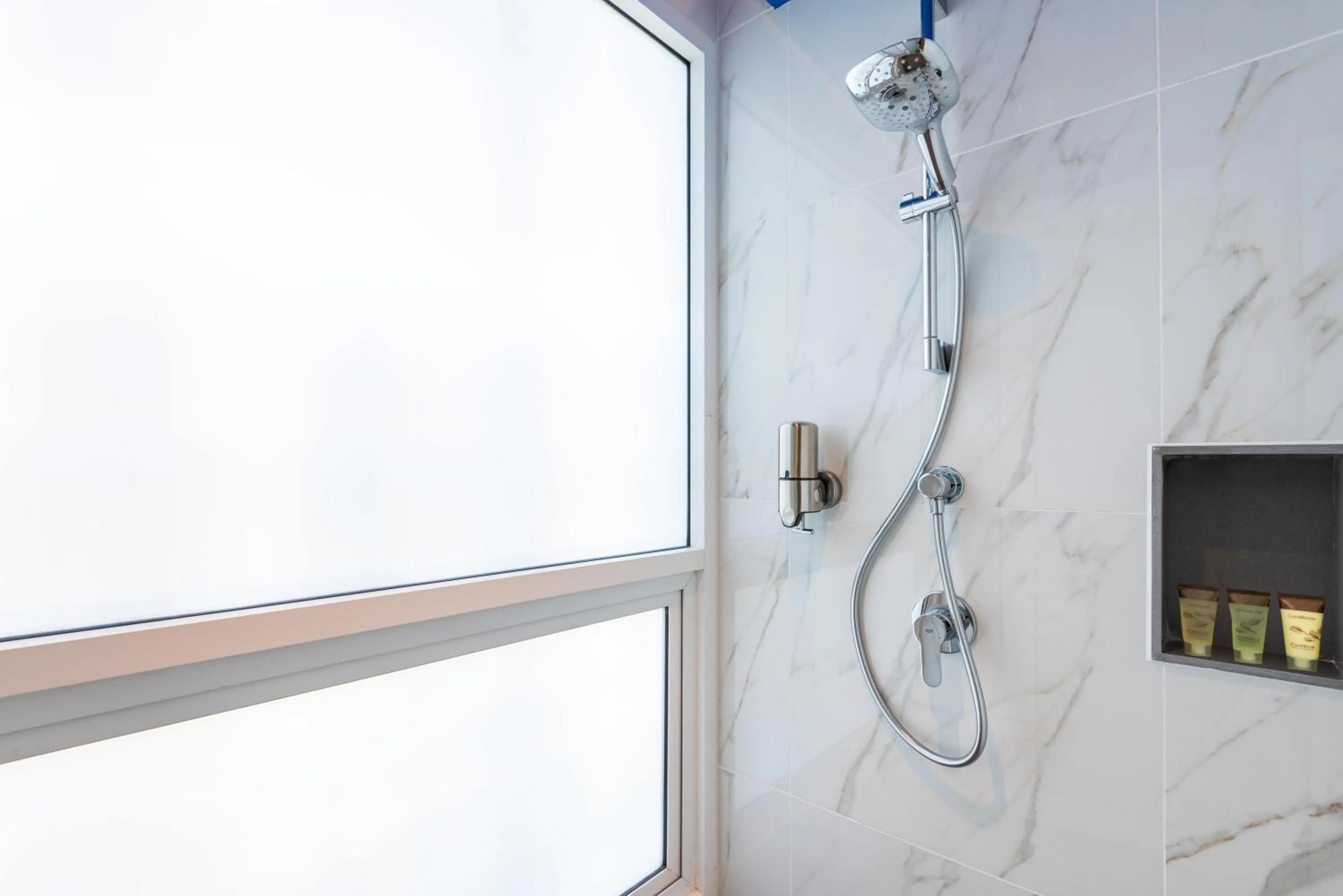 Shower in Maitria Hotel Rama 9 Bangkok - A Chatrium Collection