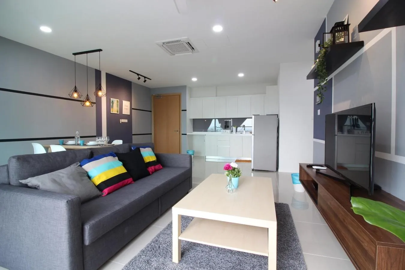Living room in Suasana Residence by Nest Home